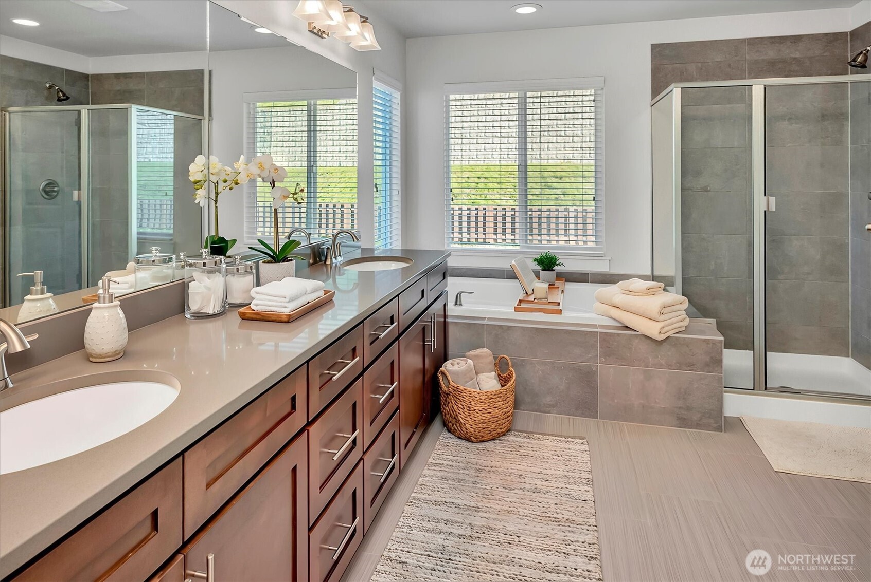 Primary bath w/ double sink/shower/bath tub.