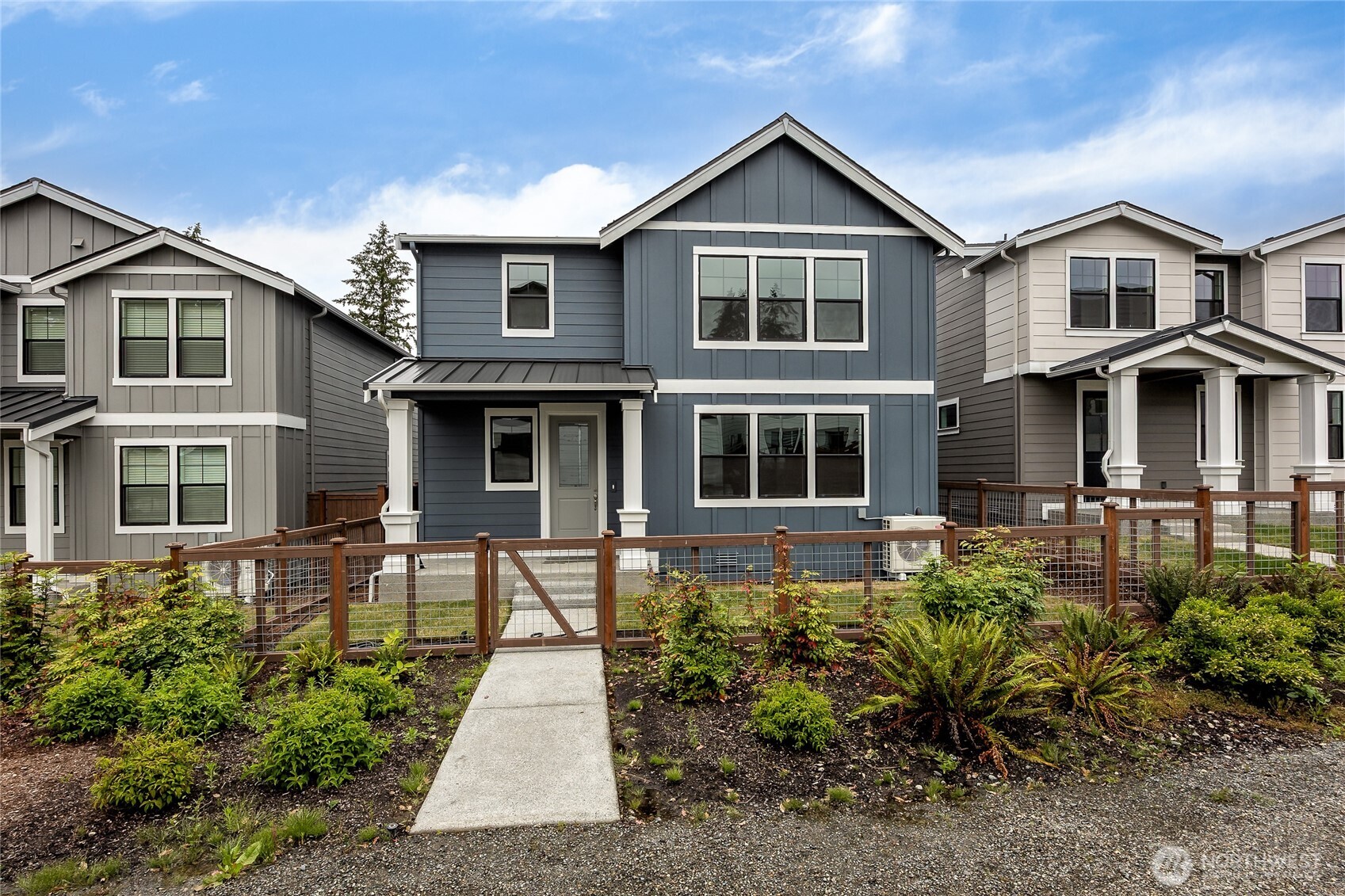 Fully fenced yard with a gate opens to community walking path. Photo is representational. Actual home is under construction and finishes and paint colors may vary. See site agent for details....