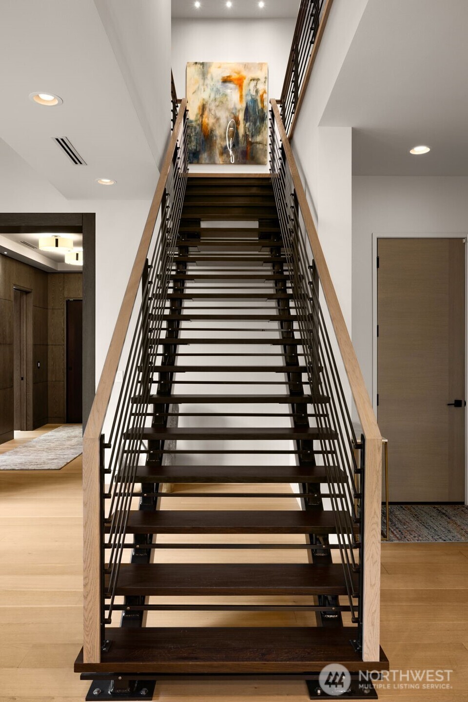 Custom designed steel staircase with solid wood treads.