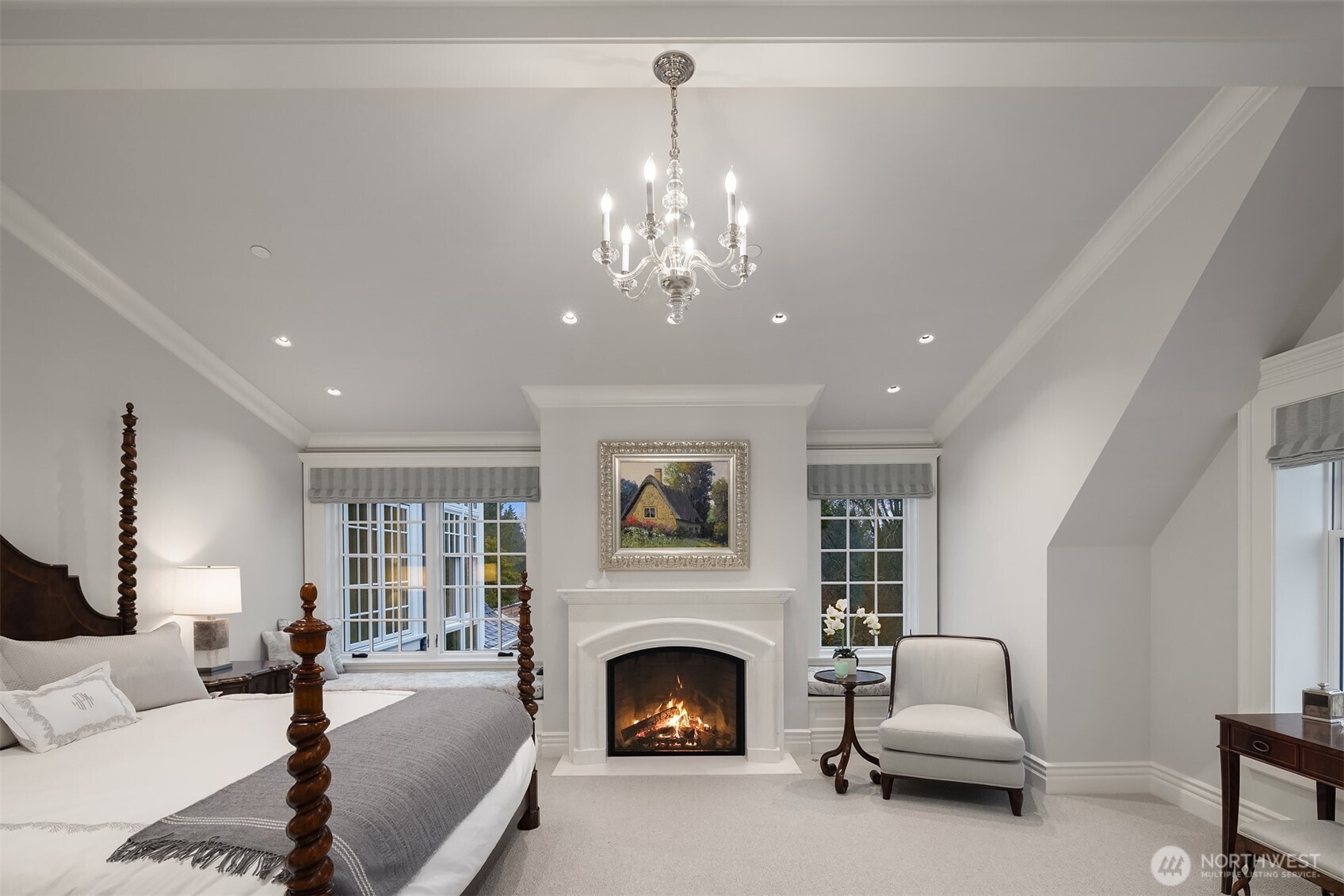 Oh this primary suite of sublime richness, warmth, views and impeccable design invites you to enjoy the beginning and end of every day. Thoughtful details include window seats, custom arched fireplace, soft carpet and beautiful custom window treatments.