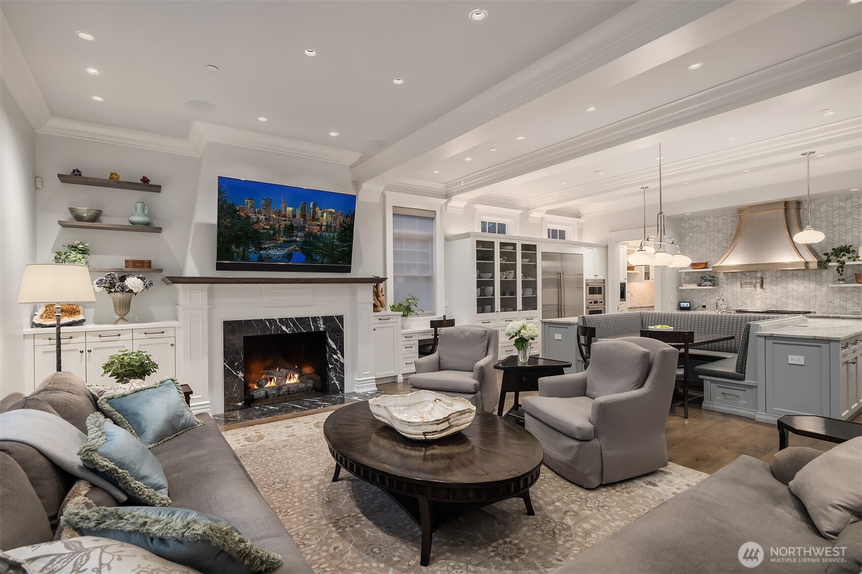 This is the best gathering room you can imagine.  Warm and cozy fires in the winter and open to the covered outdoor room, golf course and pool in the summer!