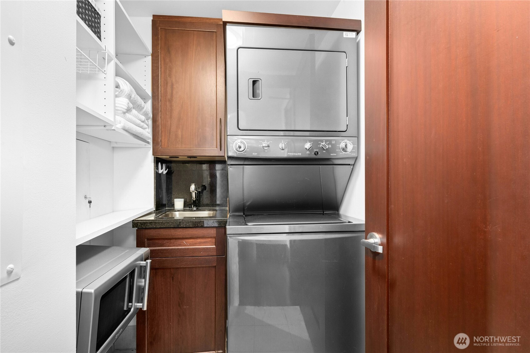 Large laundry room, with utility sink and lots of storage.