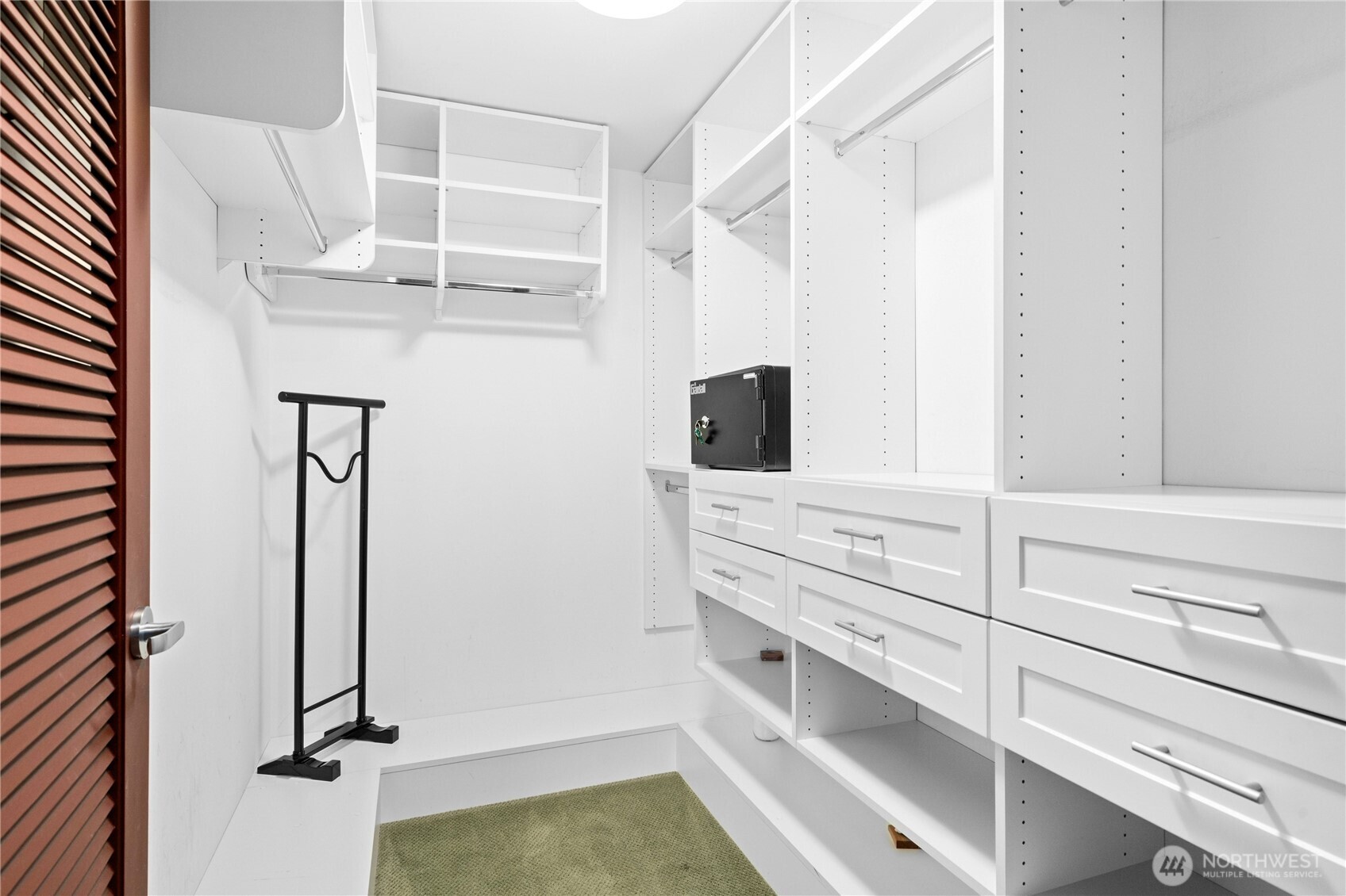 Primary bedroom walk in closet.