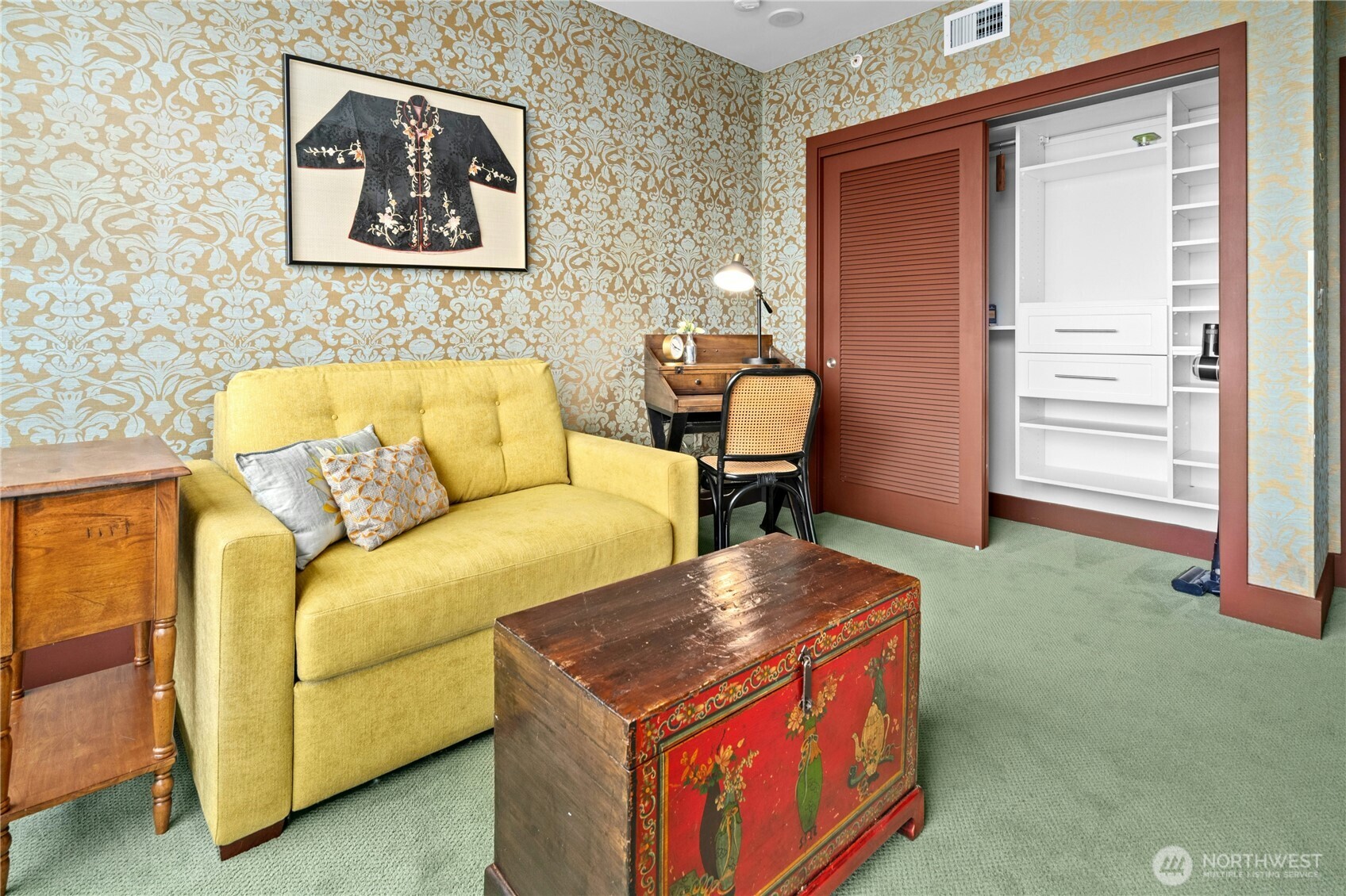 Second bedroom with a built in closet system.