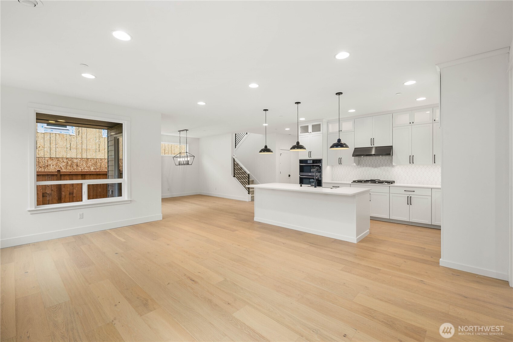 The great room’s expansive footprint connects seamlessly with the kitchen and dining area, enhanced by natural light from oversized windows. With room for multiple seating zones, this open concept is designed for easy entertaining and everyday comfort.    These photos are from lot 3 at Gooden Hollow, the actual home for sale. However, other homes may vary, so all photos, renderings, site maps, and floorplans are for visualization purposes only. Plans, colors, building orientation, finishes, home outlook, and other details can and WILL vary.