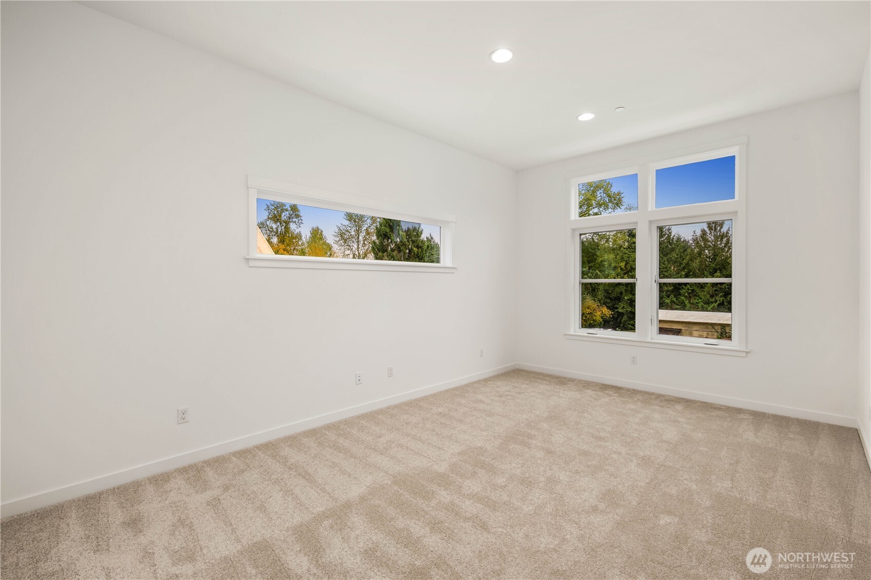 This open bonus loft on the upper level offers a bright, flexible space ideal for a media area, play zone, or secondary lounge. Large windows bring in natural light and frame neighborhood views, making it an easy place to gather, work, or unwind.    These photos are from lot 3 at Gooden Hollow, the actual home for sale. However, other homes may vary, so all photos, renderings, site maps, and floorplans are for visualization purposes only. Plans, colors, building orientation, finishes, home outlook, and other details can and WILL vary.