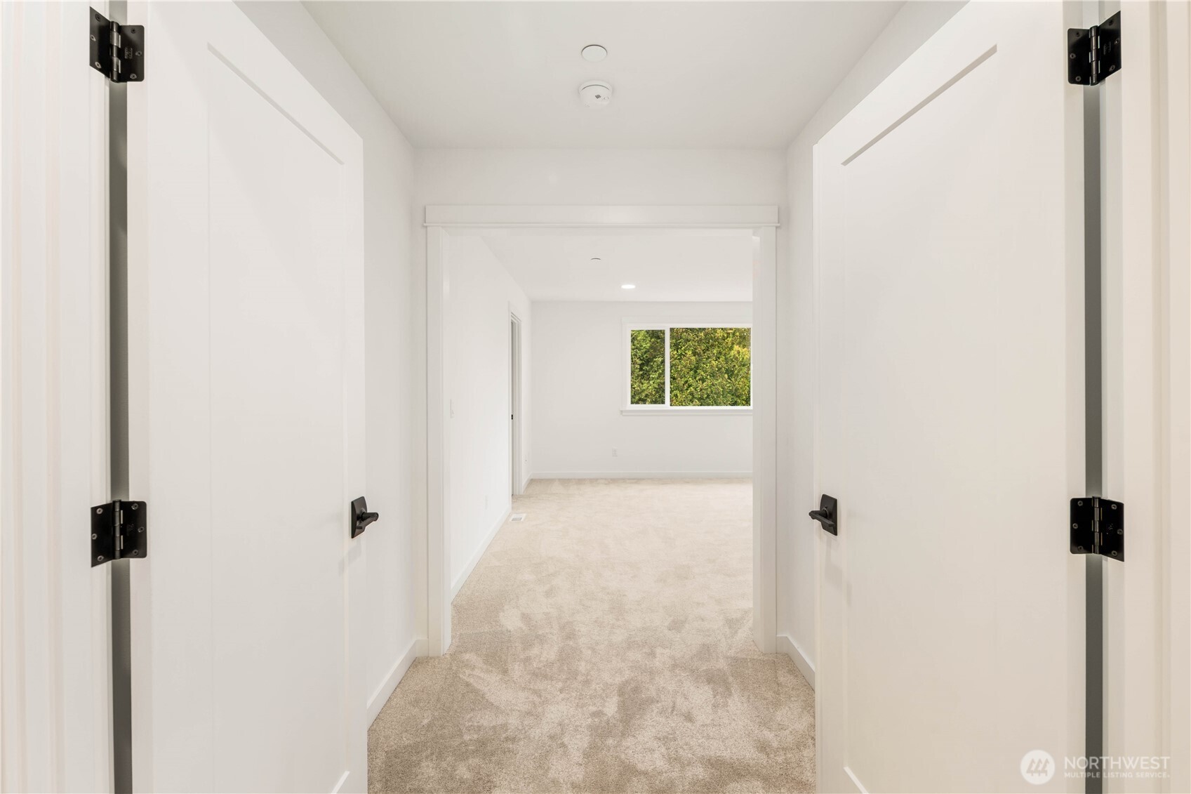 A wide double-door entry leads into the expansive upper-level primary bedroom retreat, creating a dramatic and inviting transition. This layout offers privacy and spaciousness, ideal for crafting a dedicated lounge, media zone, or creative flex area.    These photos are from lot 3 at Gooden Hollow, the actual home for sale. However, other homes may vary, so all photos, renderings, site maps, and floorplans are for visualization purposes only. Plans, colors, building orientation, finishes, home outlook, and other details can and WILL vary.
