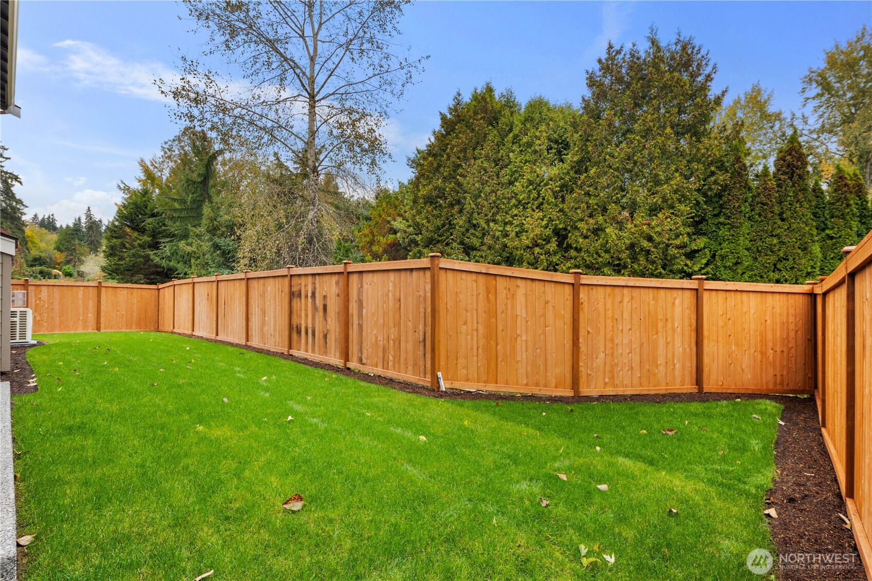 A fully fenced backyard with fresh sod and a long stretch of usable lawn, creating a private retreat for play, pets, or simple quiet moments. The space offers both openness and easy maintenance.    These photos are from lot 3 at Gooden Hollow, the actual home for sale. However, other homes may vary, so all photos, renderings, site maps, and floorplans are for visualization purposes only. Plans, colors, building orientation, finishes, home outlook, and other details can and WILL vary.