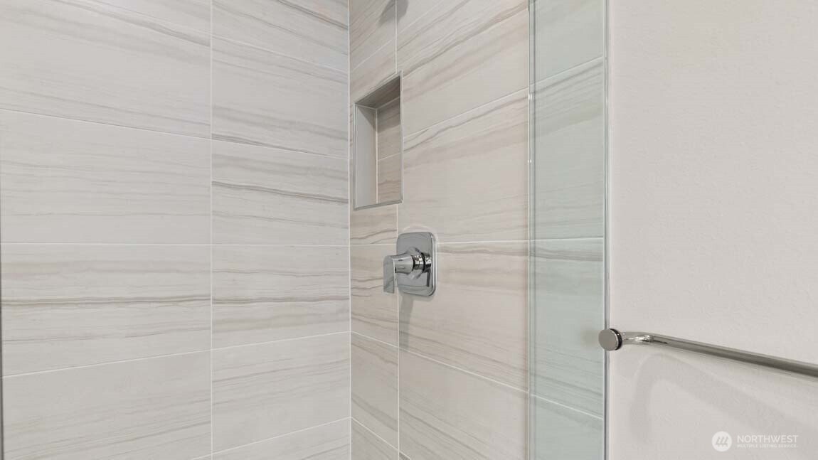 Nicely appointed shower in primary!