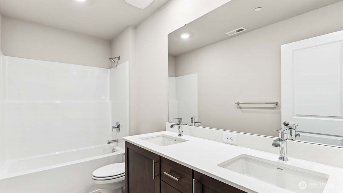 2nd floor main bath with dual sinks.