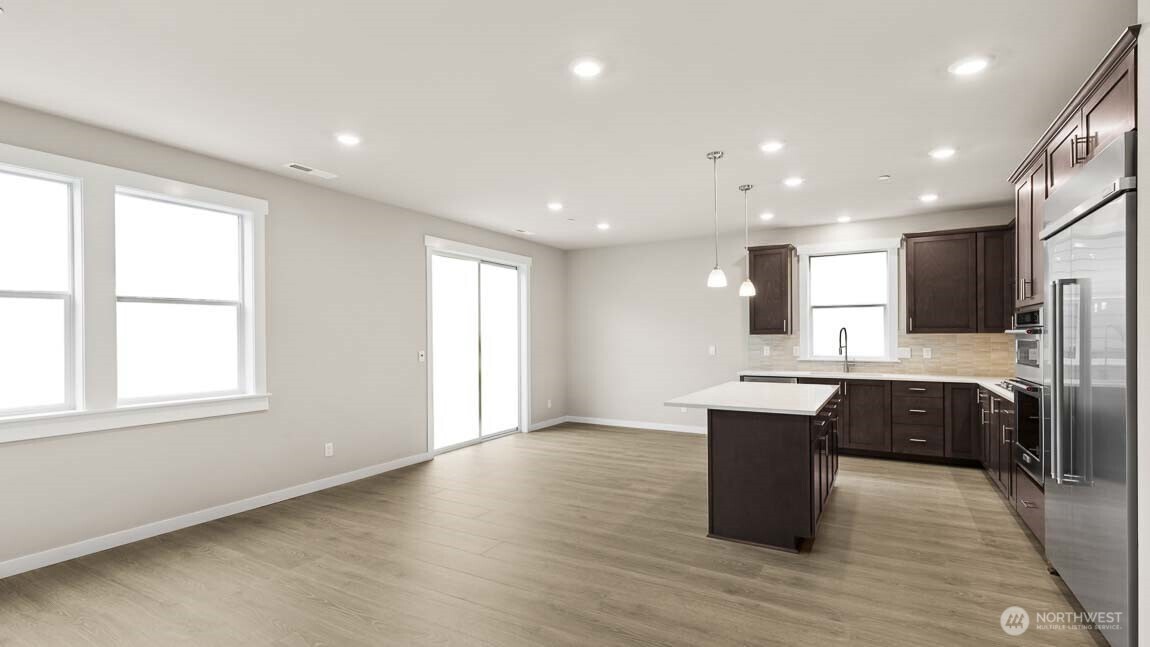 Gorgeous kitchen with plenty of storage and counter space to prep your meals or host a dinner party!  48" counter depth side by side built in refrigerator, gas cooktop and built in micro/oven.