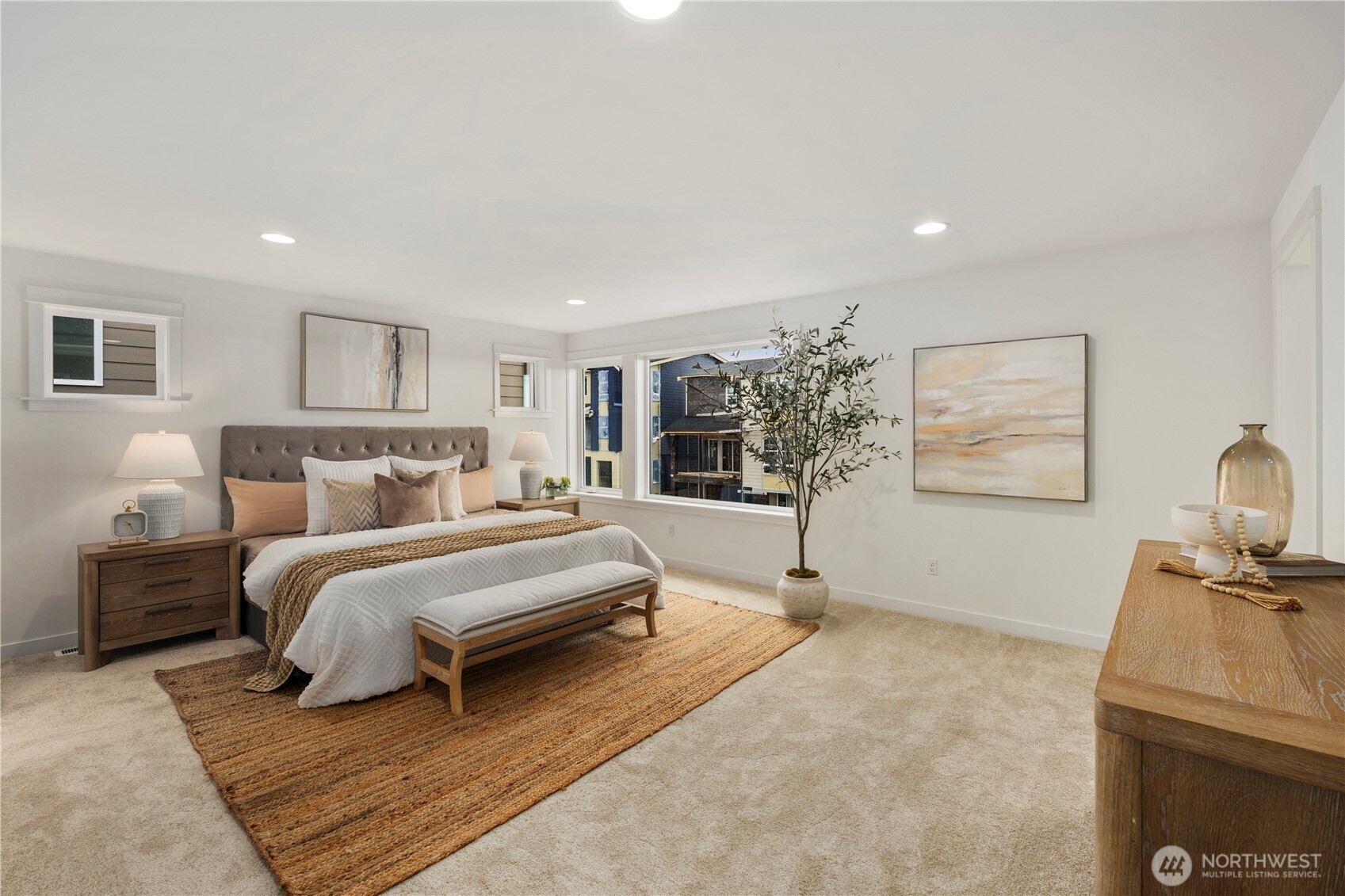 Primary Bedroom: Expansive primary suite offers plush carpeting, recessed lighting, and oversized windows that capture natural light and neighborhood views. The generous layout creates a serene retreat with space to unwind at the end of the day.    Photos are from the model home at Foxmoore and for visualization purposes only. Plans, colors, building orientation, finishes, home outlook, and other details can and WILL vary.