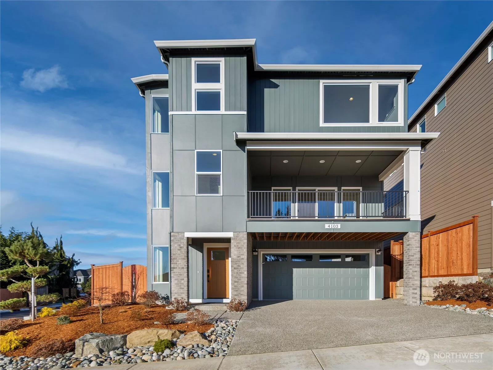 The Glacier Home Plan. All photos, renderings, site maps, and floorplans are for visualization purposes only. Plans, colors, building orientation, finishes, home outlook, and other details can and WILL vary. Striking three-level Glacier plan showcases a modern Craftsman façade with brick accents, vertical siding, and oversized windows for maximum natural light. Covered balcony and welcoming entry set the tone for refined living in Bothell’s Foxmoore community, close to Canyon Park conveniences and I-405 access.