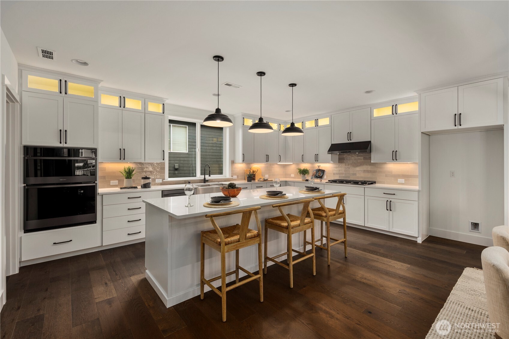 Kitchen: Expansive chef’s kitchen features quartz countertops, oversized island with seating, and full-height cabinetry with display transoms for added style and storage. Stainless steel appliances, pendant lighting, and a walk-in pantry create the perfect balance of form and function for everyday living or entertaining.    Photos are from THIS model home at Foxmoore but are for visualization purposes only.
