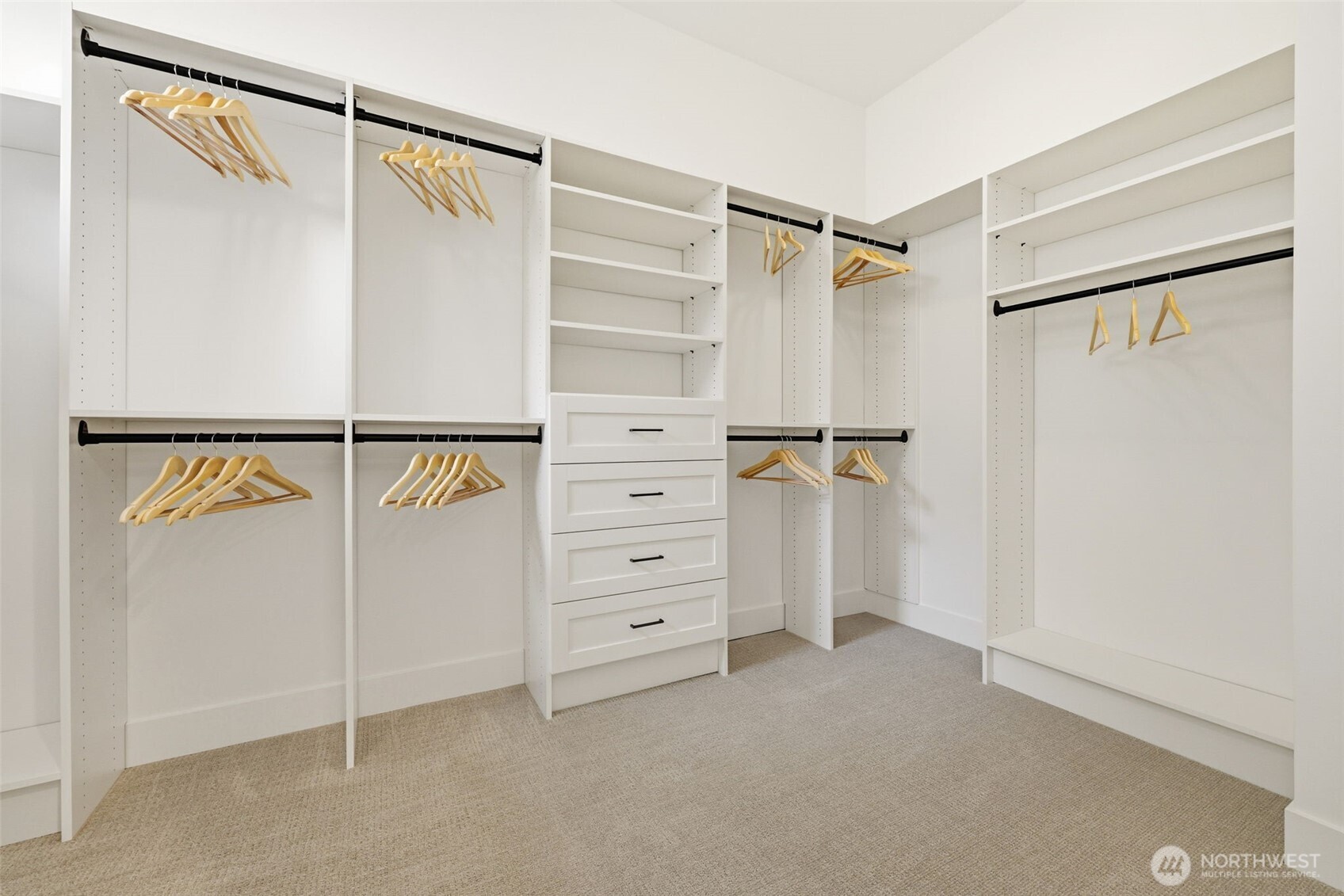 Just one of the two closets the primary suite has to offer