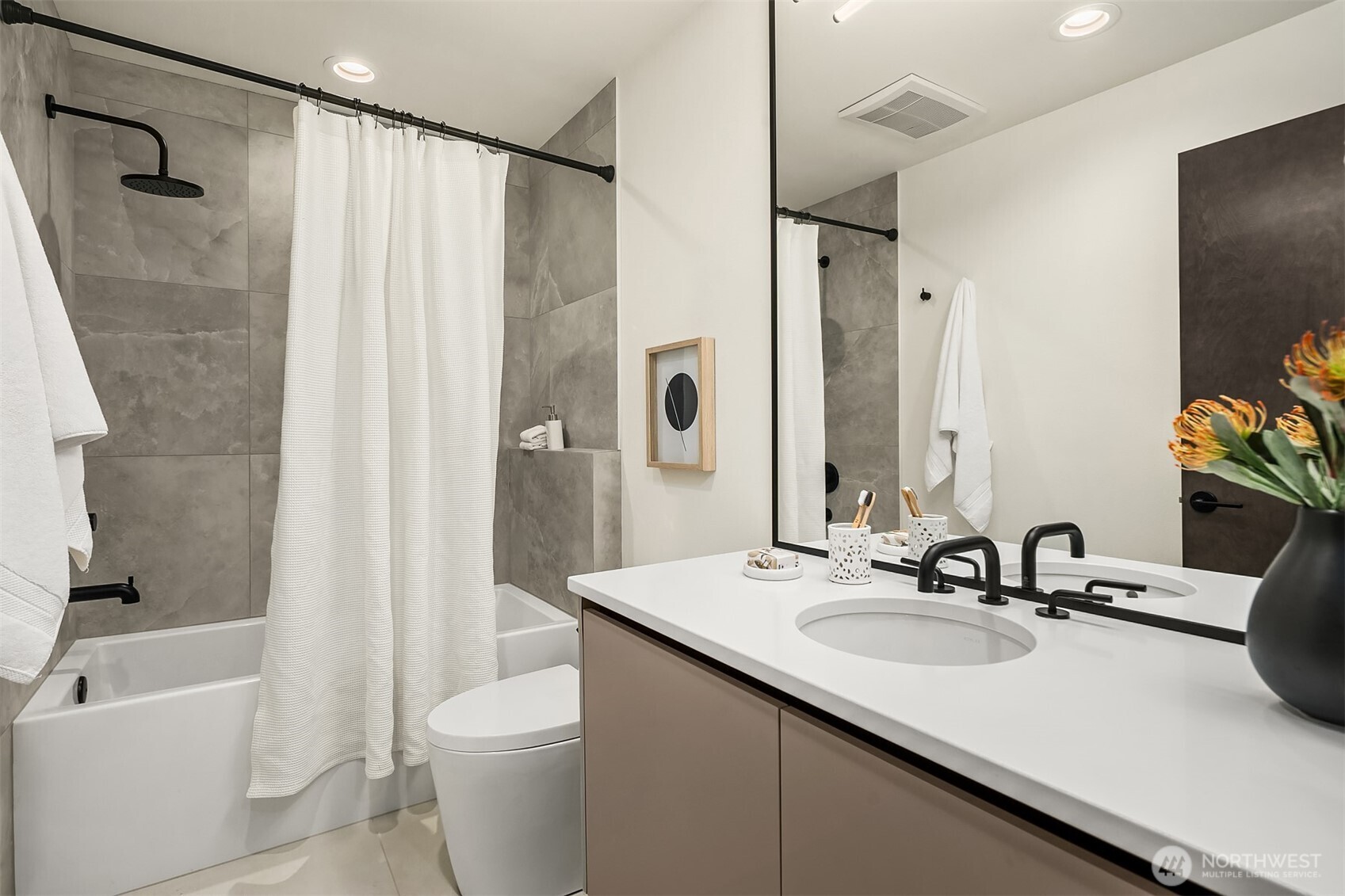 Primary bathroom with curbless shower and floating double vanity
