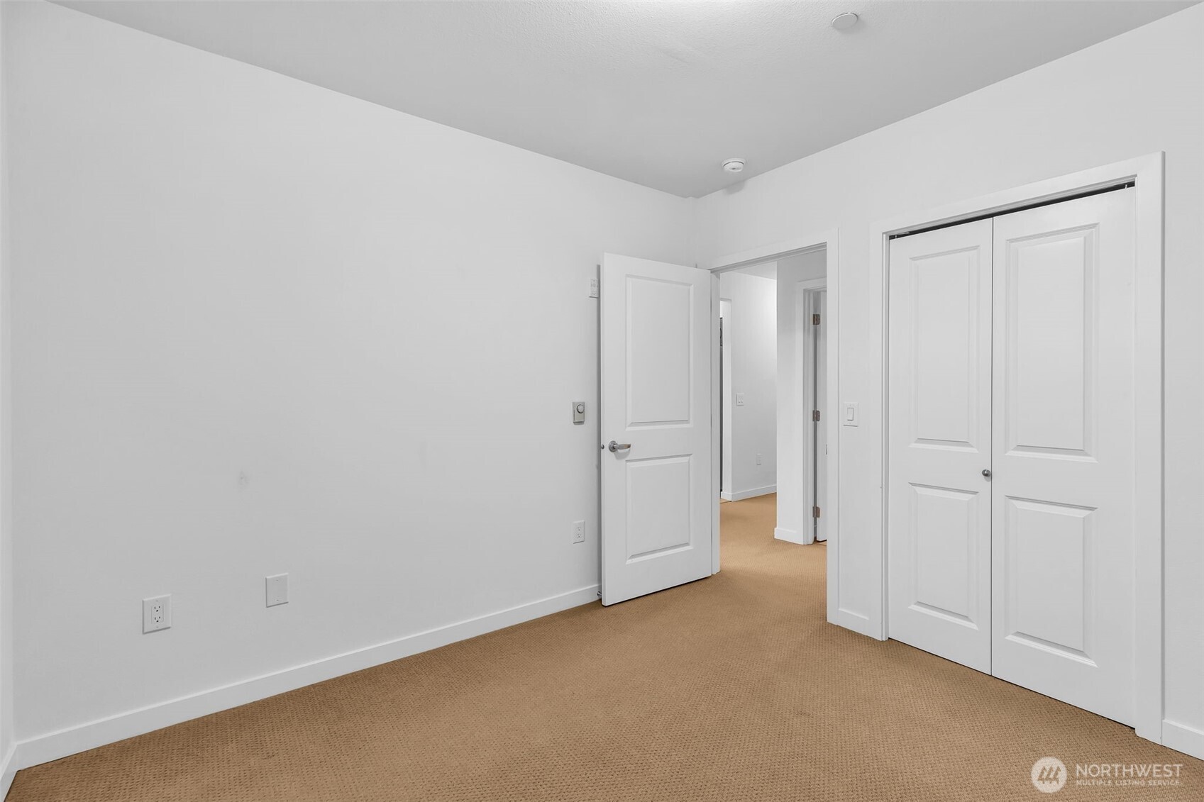 Bedroom with walk-in closet.