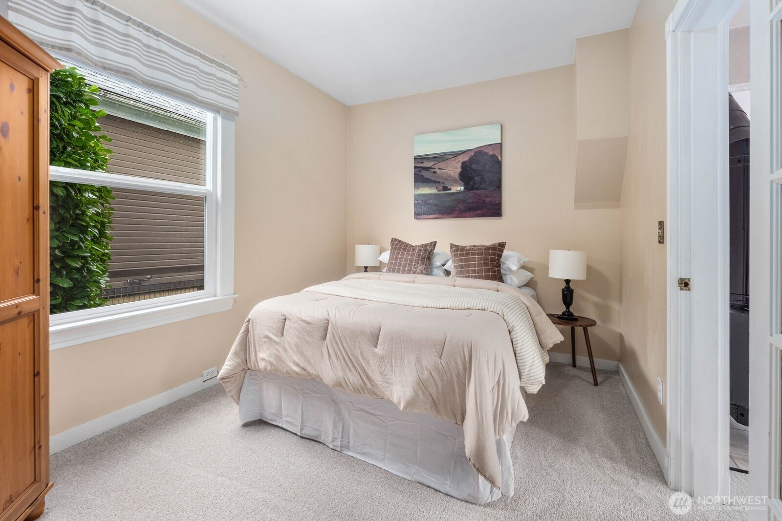 Main floor bedroom option or office is a great size for however you live. Armoire stays with the buyer.
