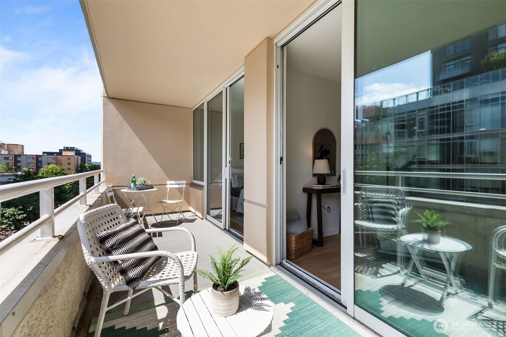 Wide balcony with dual access from living area and bedroom