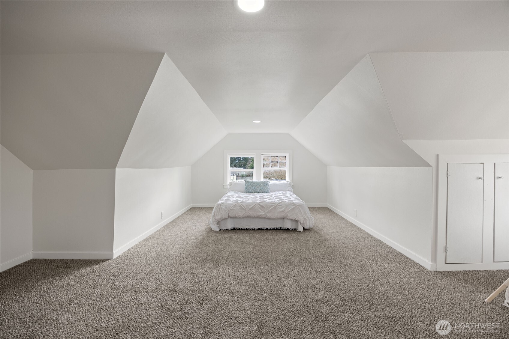 Smaller L shaped bedroom upstairs.