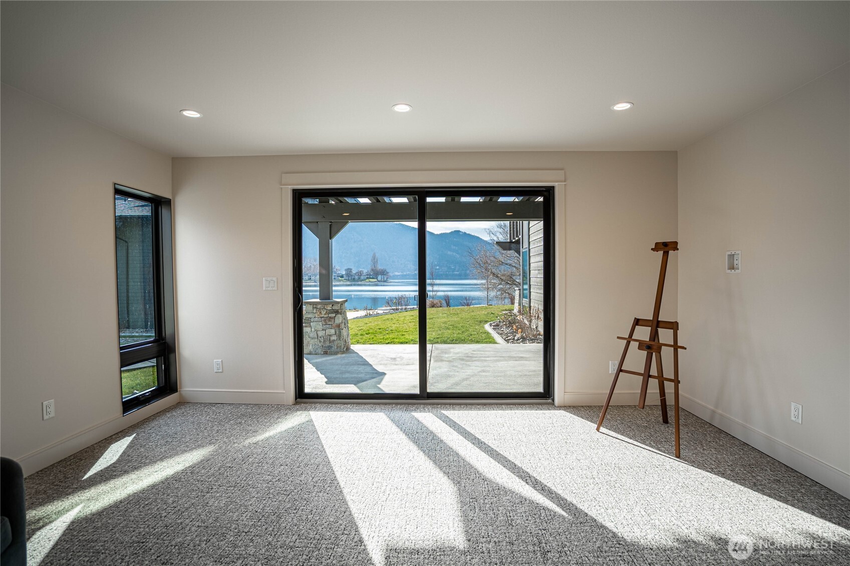 This light-filled second bedroom also features a glorious view of Lake Chelan, just steps away from the back patio.