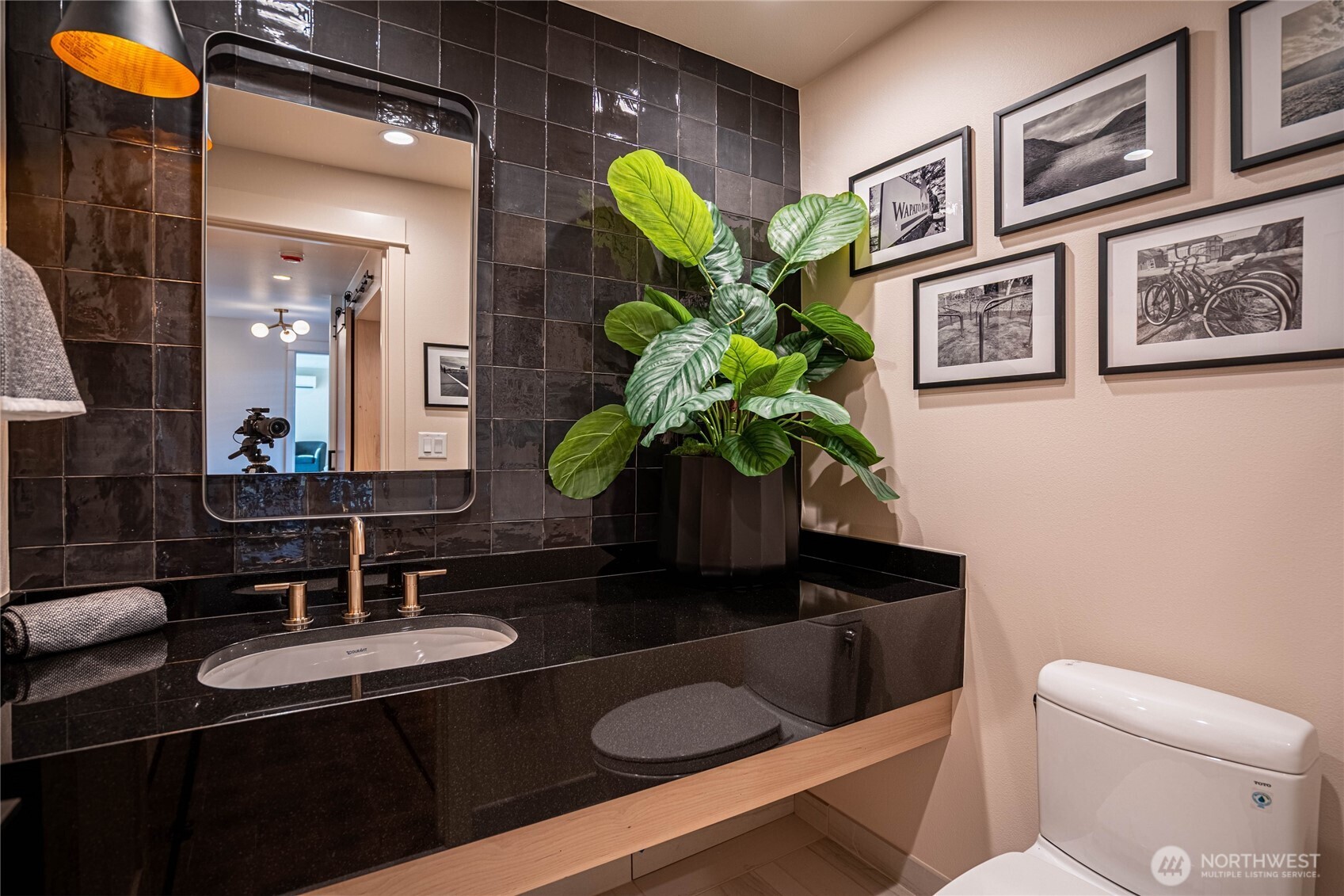 Stylish and modern half-bath in the entry area.