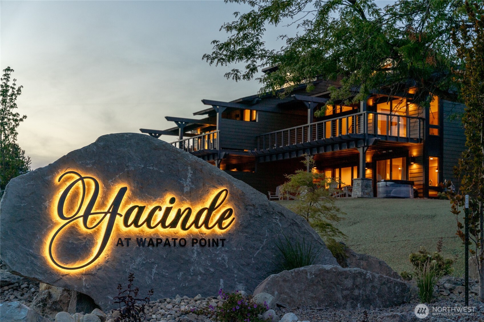 Yacinde entry sign at dusk