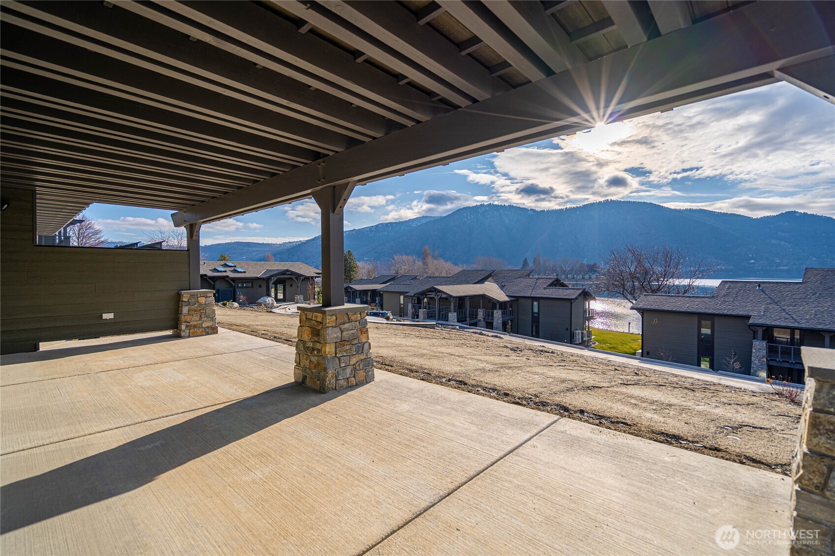 Spacious covered patio outside the living room lets you enjoy the outdoors any time of year. Pre-wired for ceiling patio heaters and pre-wired for your private hot tub addition.