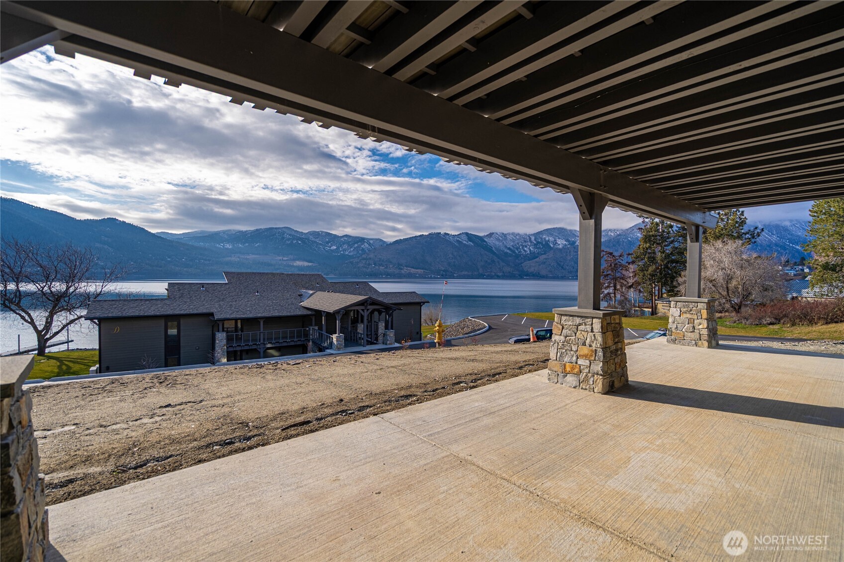 Covered patio extends from the living room area to in front of the primary bedroom.