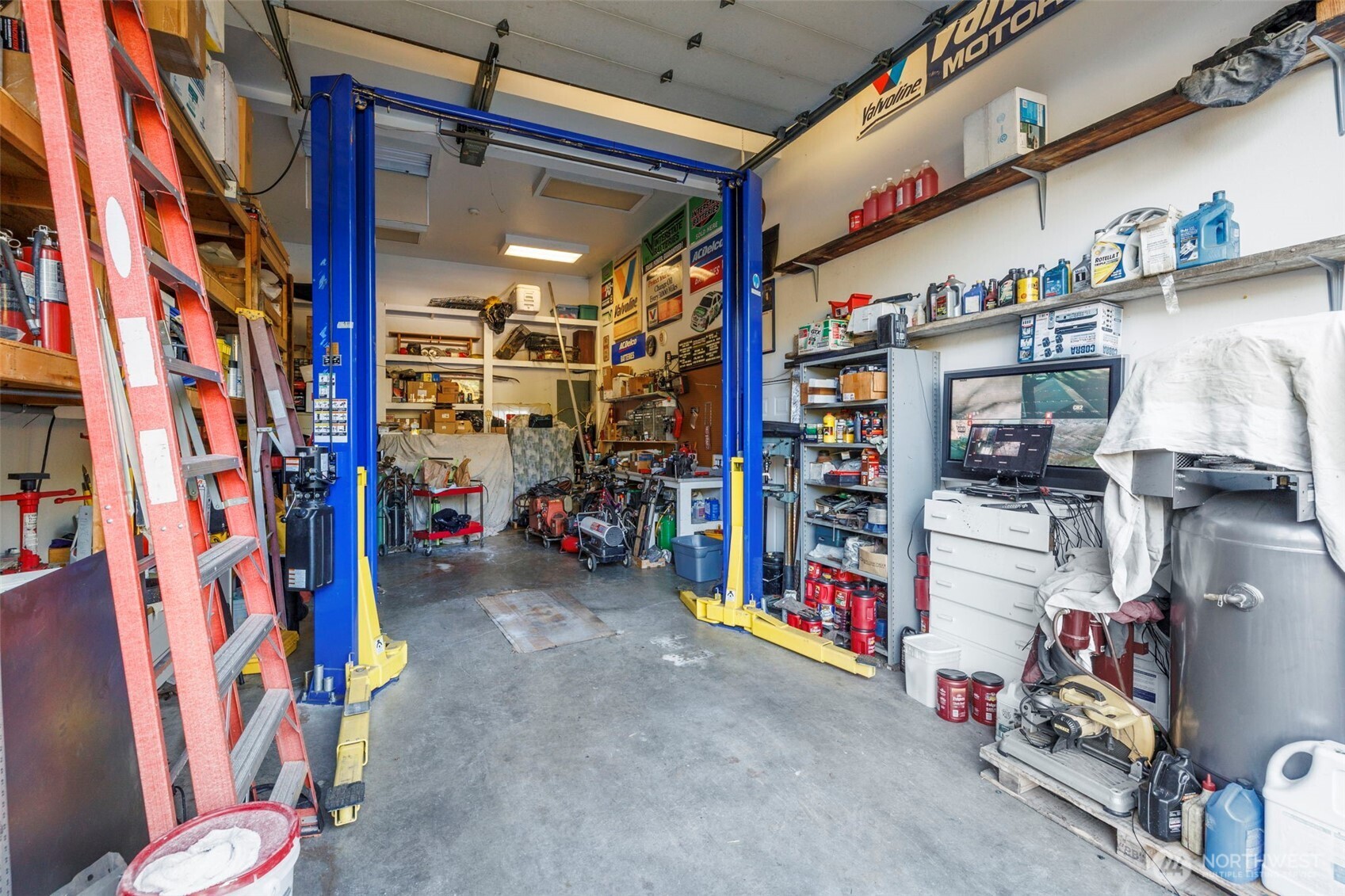 Mechanics Bay with Lift, Garage Wraps around entire lower level