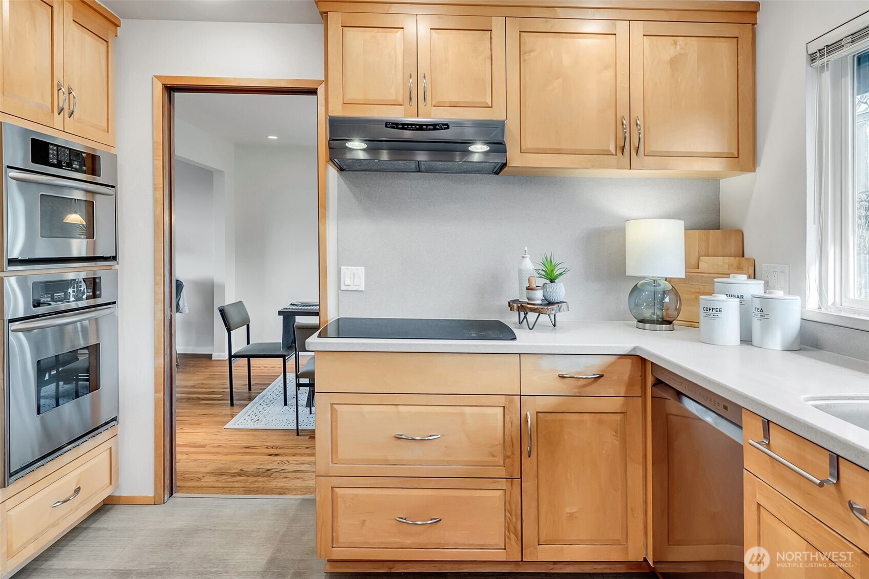 Custom floor to ceiling cabinets with pull-outs and peninsula storage on both sides.
