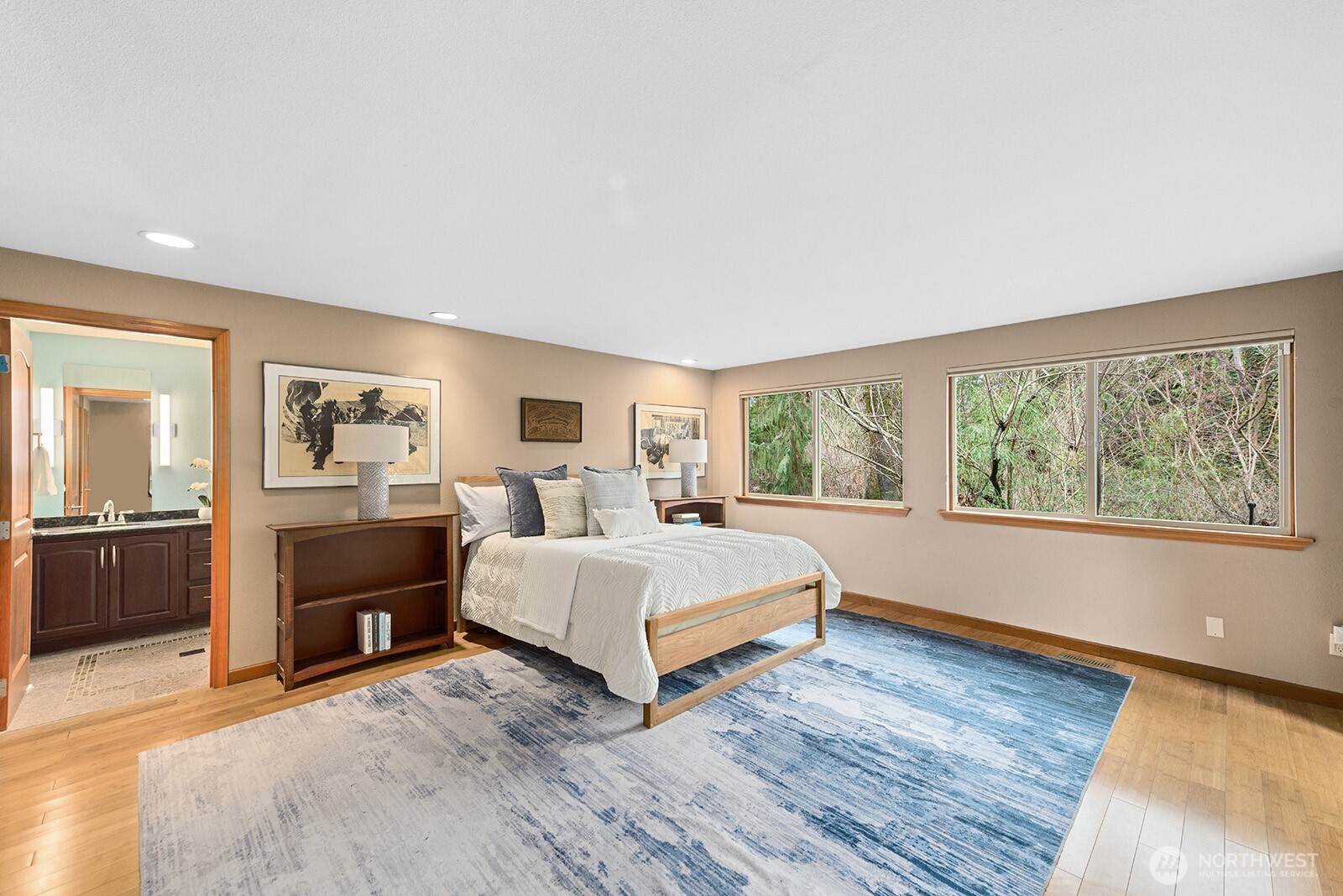 The large, light-filled primary suite is a retreat unto itself.