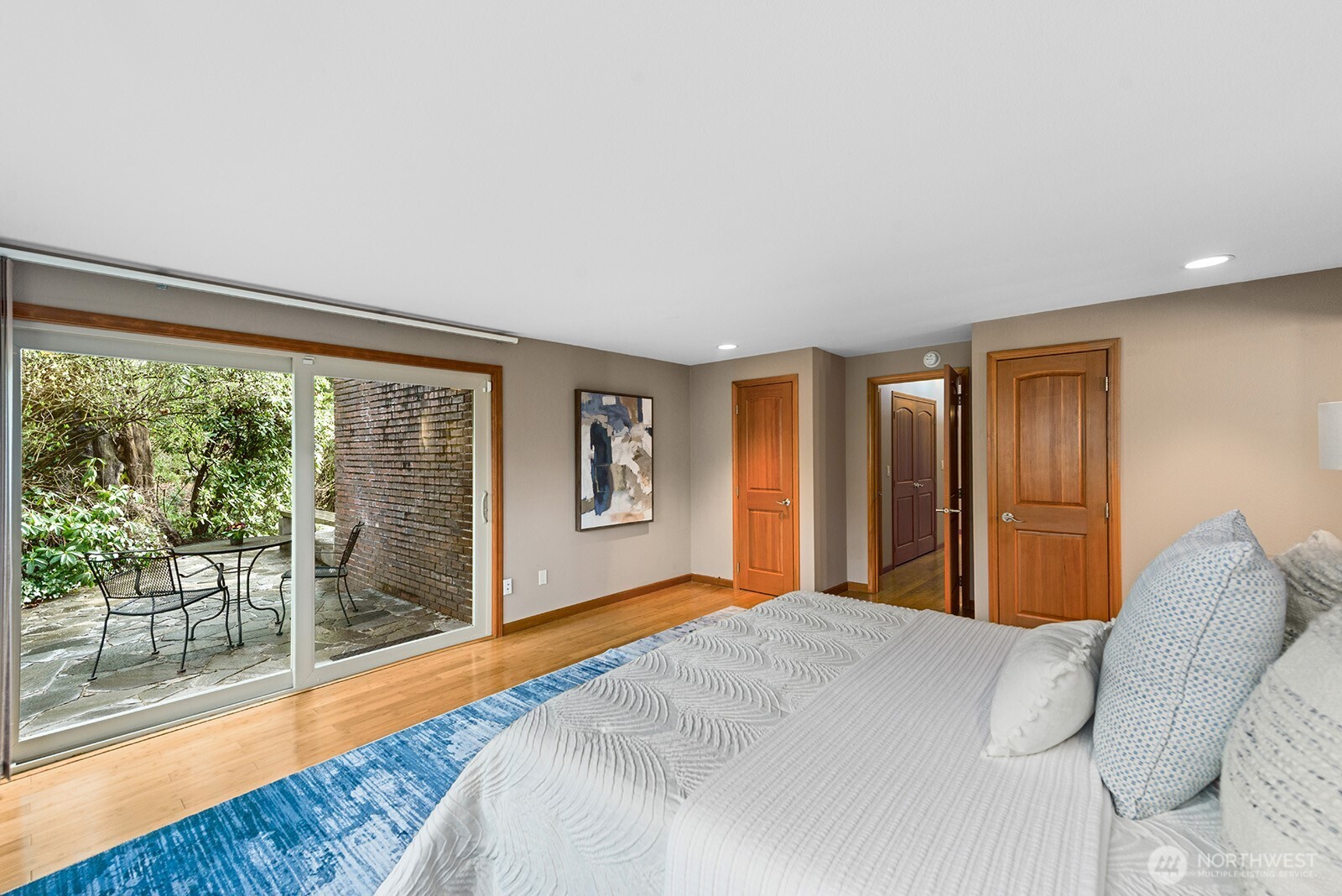 The primary suite opens to its own private patio.