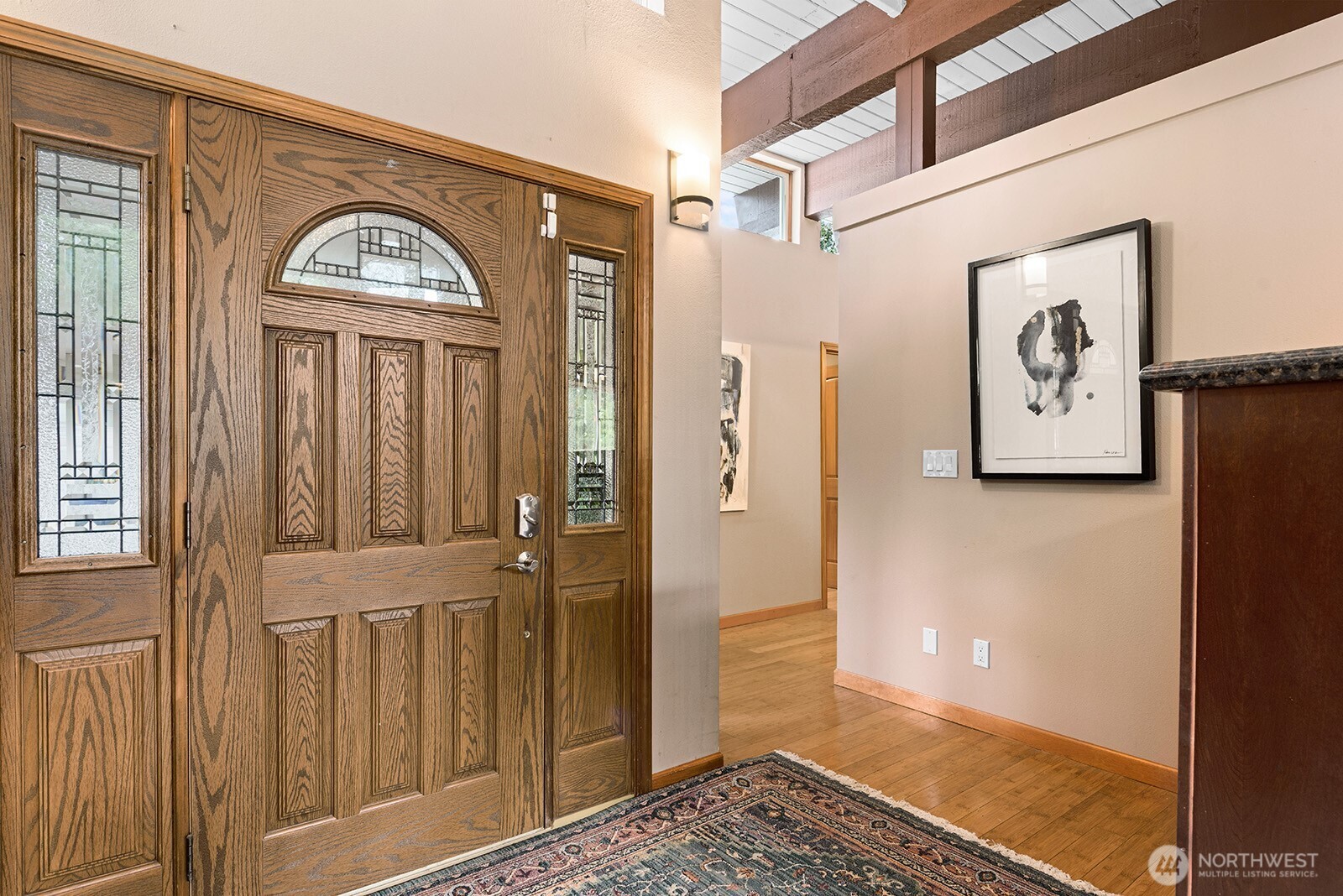 Starting with the front door, natural wood is featured throughout the house.