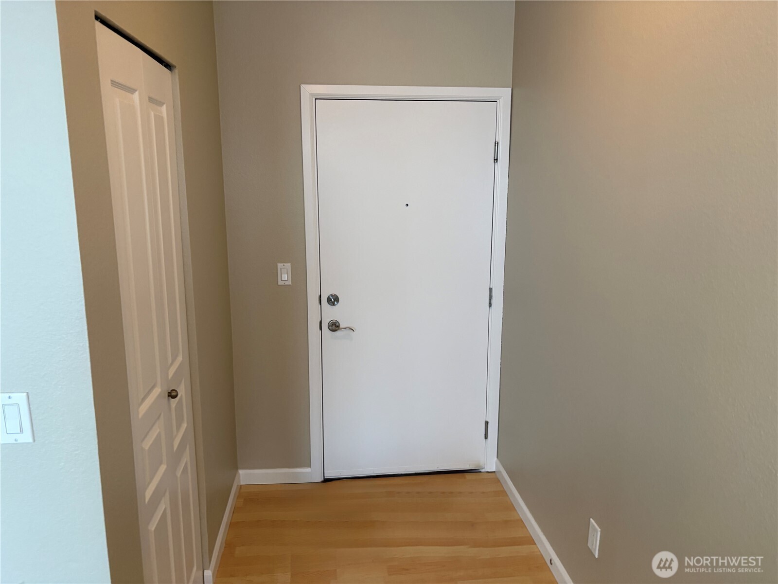 Welcoming entry foyer with durable flooring and clean architectural lines, setting the tone for modern condo living.