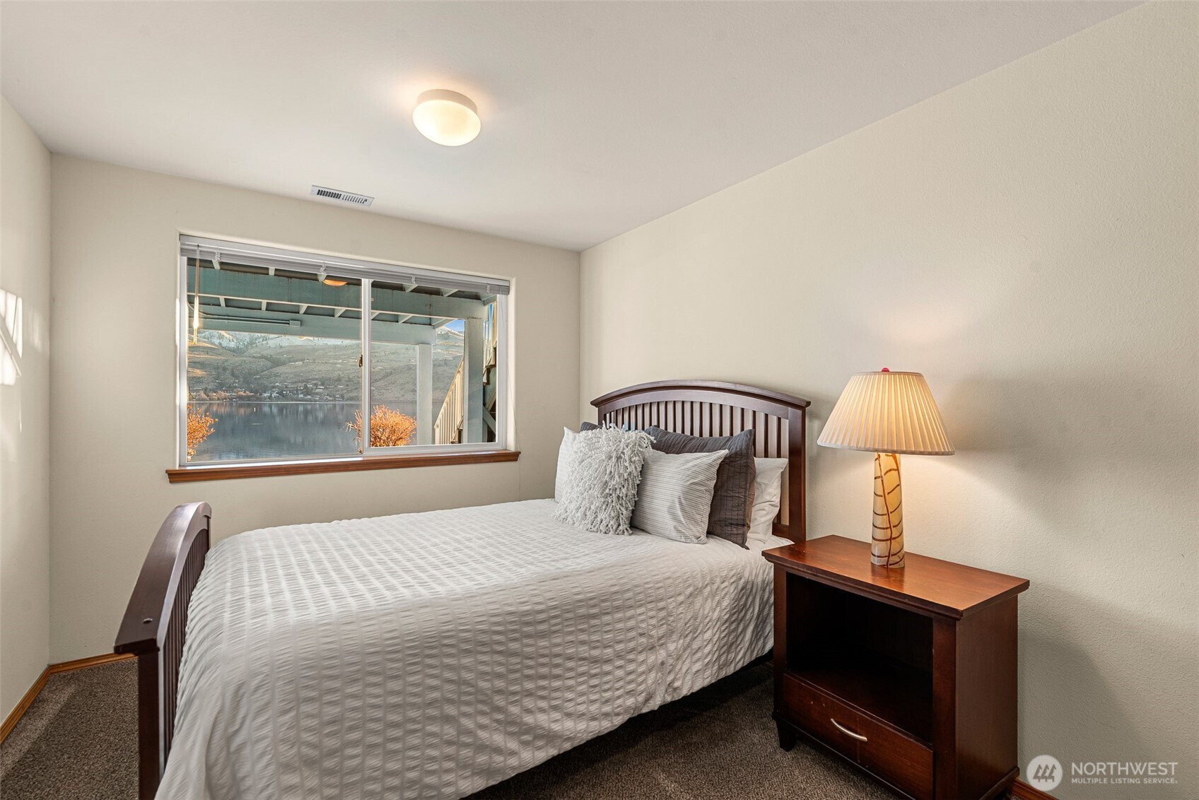 Lower level queen bedroom with lake views