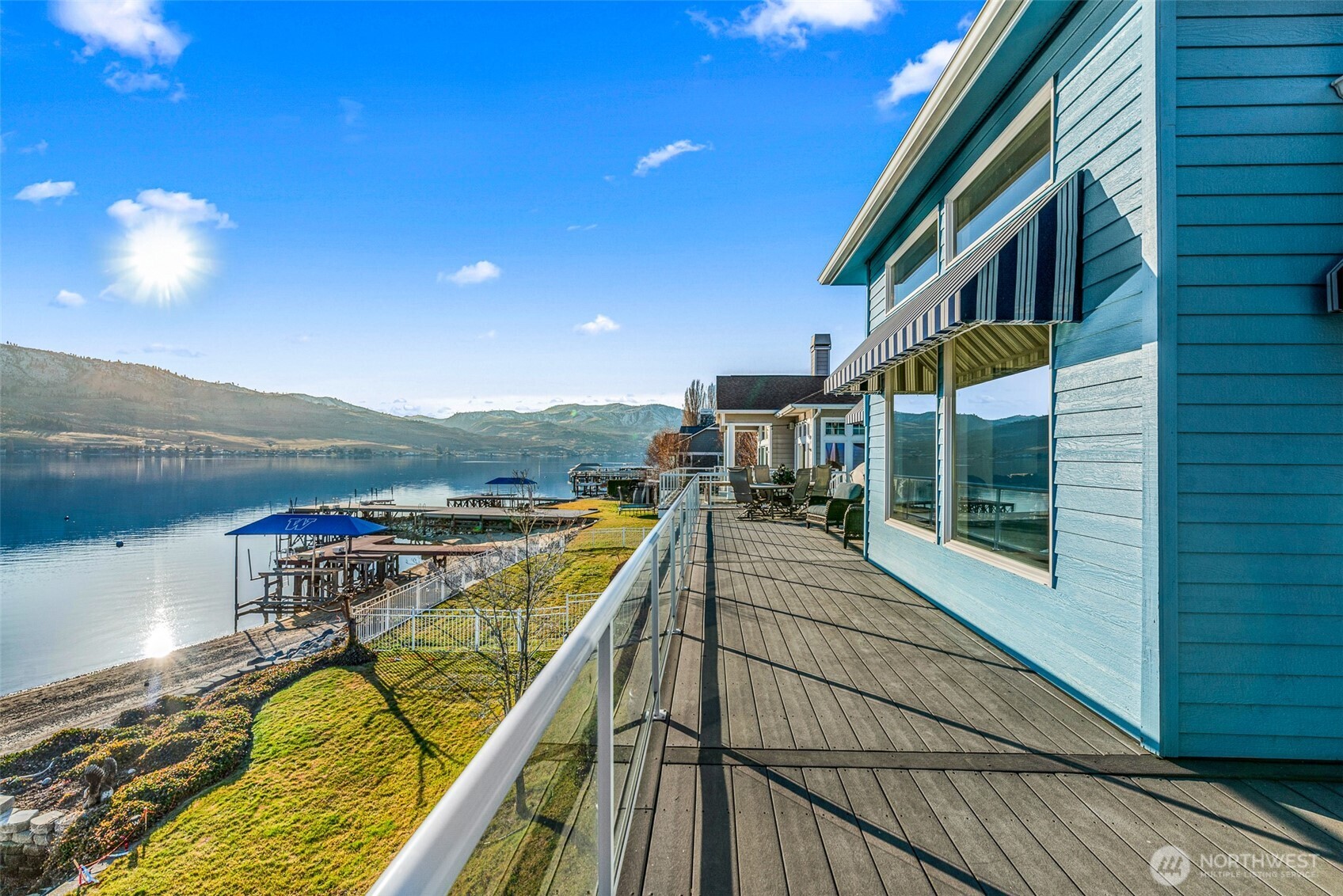 Expansive upper deck overlooking breathtaking views of the lake and mountains