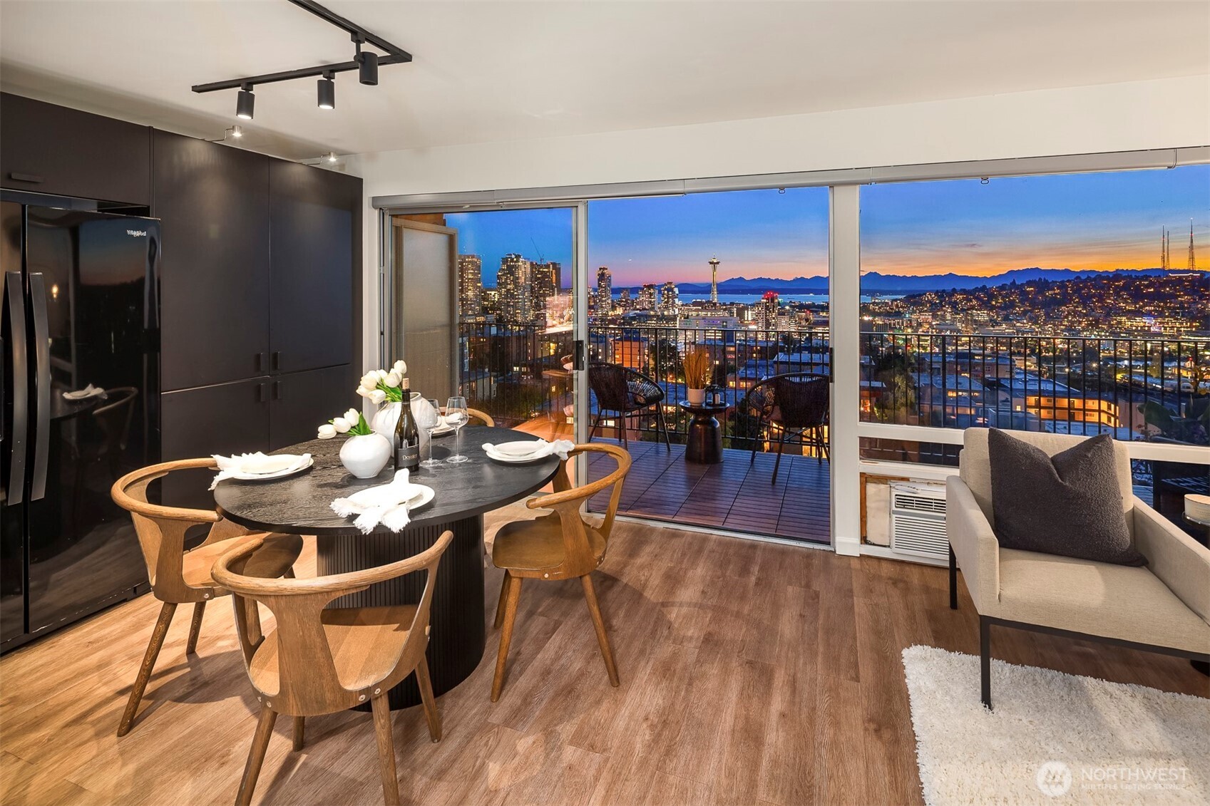 A wall of windows and an expansive private terrace invite you to take in the changing skies, vibrant sunsets, and sparkling city lights from your own private perch above it all.