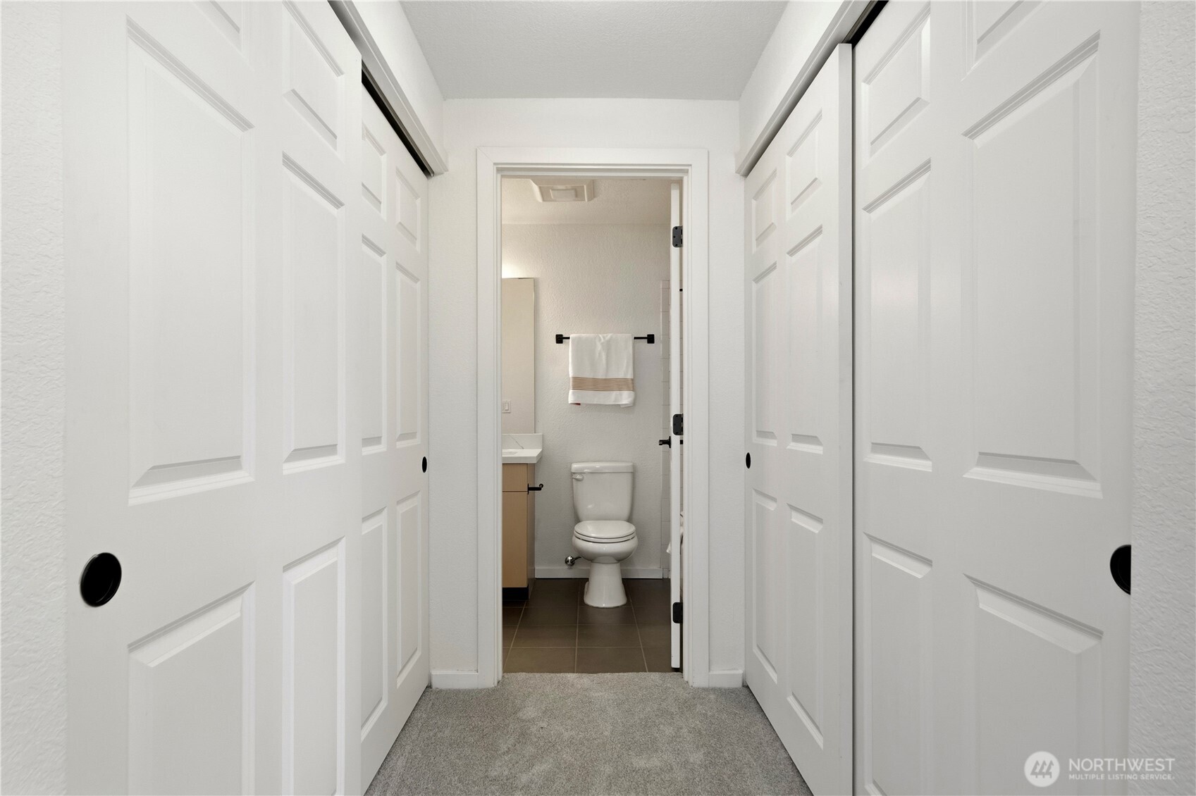 Primary bedroom featuring dual closets for ample storage.