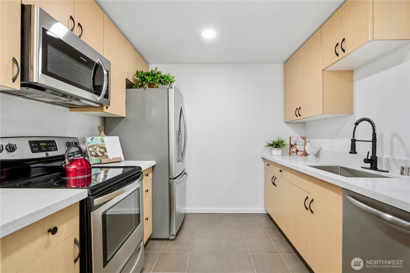 Updated kitchen featuring new countertops and modern finishes.
