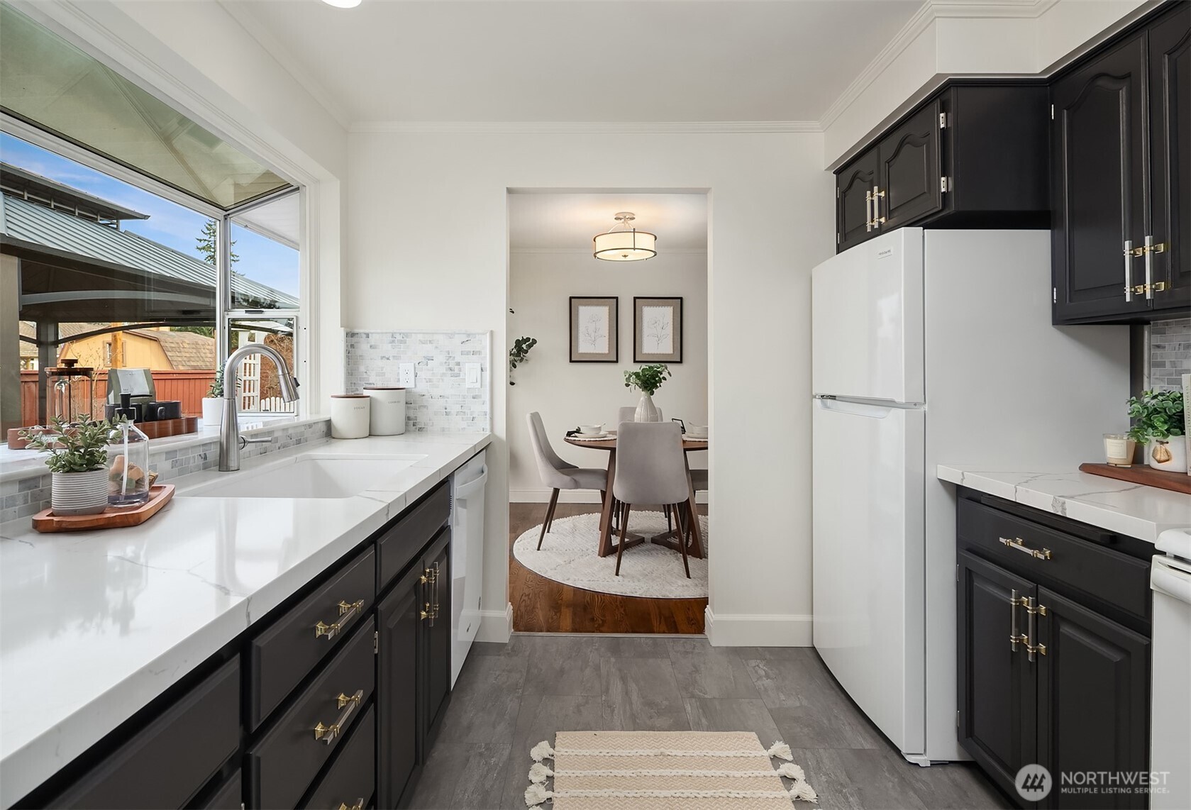 Kitchen flowing seamlessly into dining area.