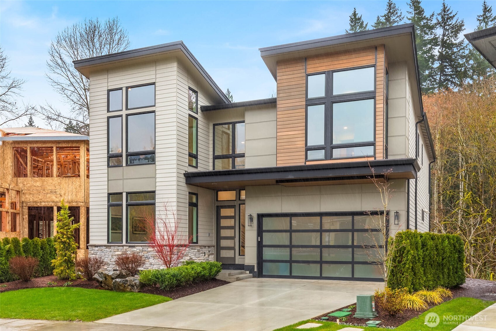Soaring window walls on both sides of the home funnel natural light throughout the residence while open to territorial views. Front of the home looks out onto the community great lawn while the back faces the protected greenbelt and Tibbetts Creek