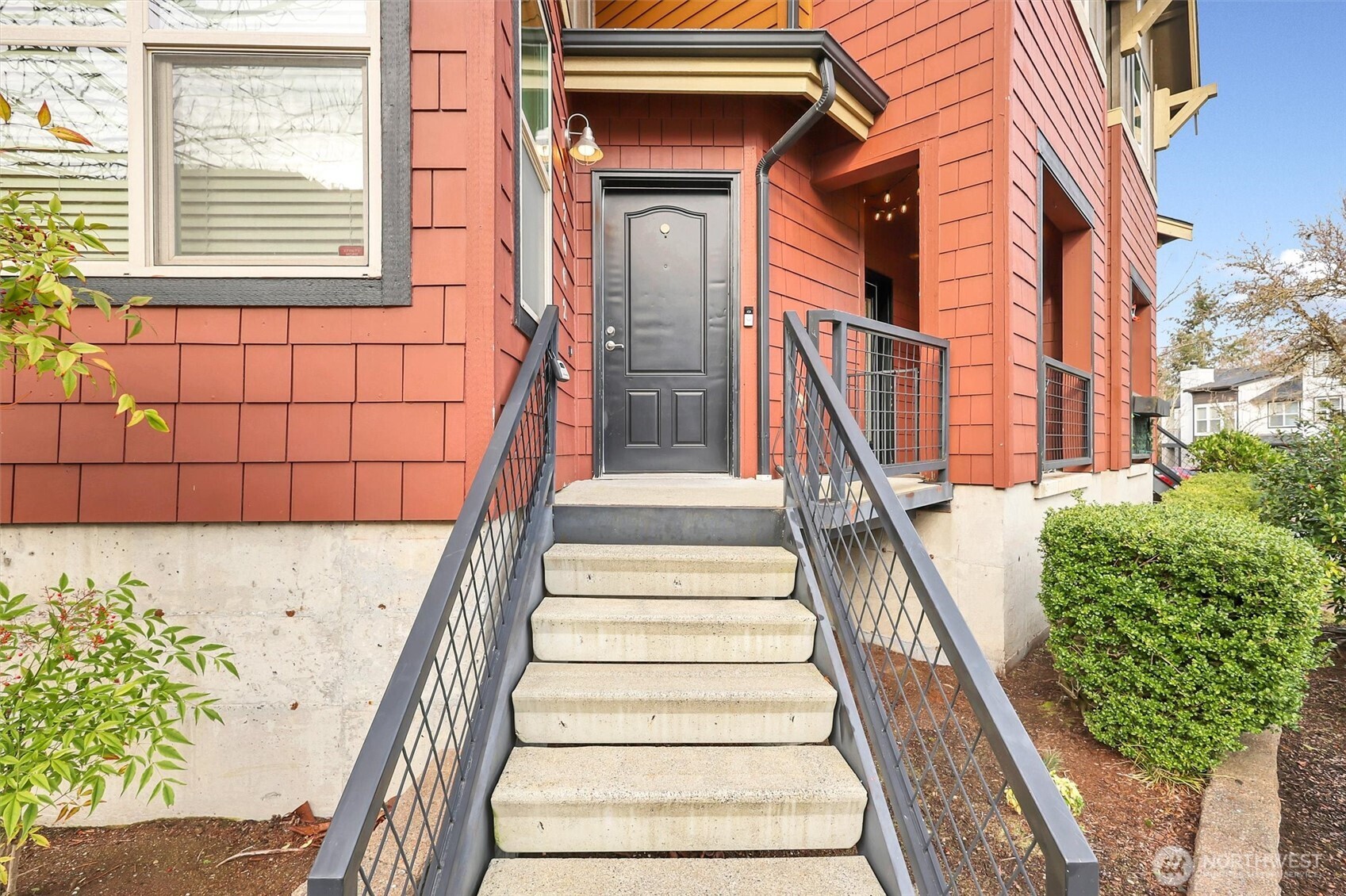Welcoming front steps and mature landscaping.
