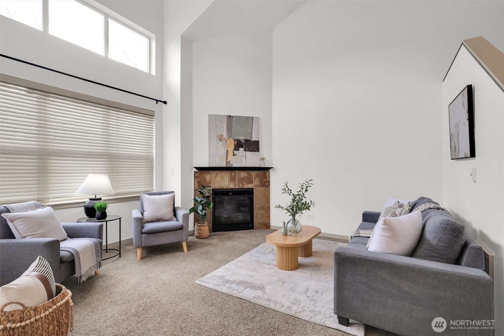 Light-filled living room with soaring ceilings and an open, comfortable layout.