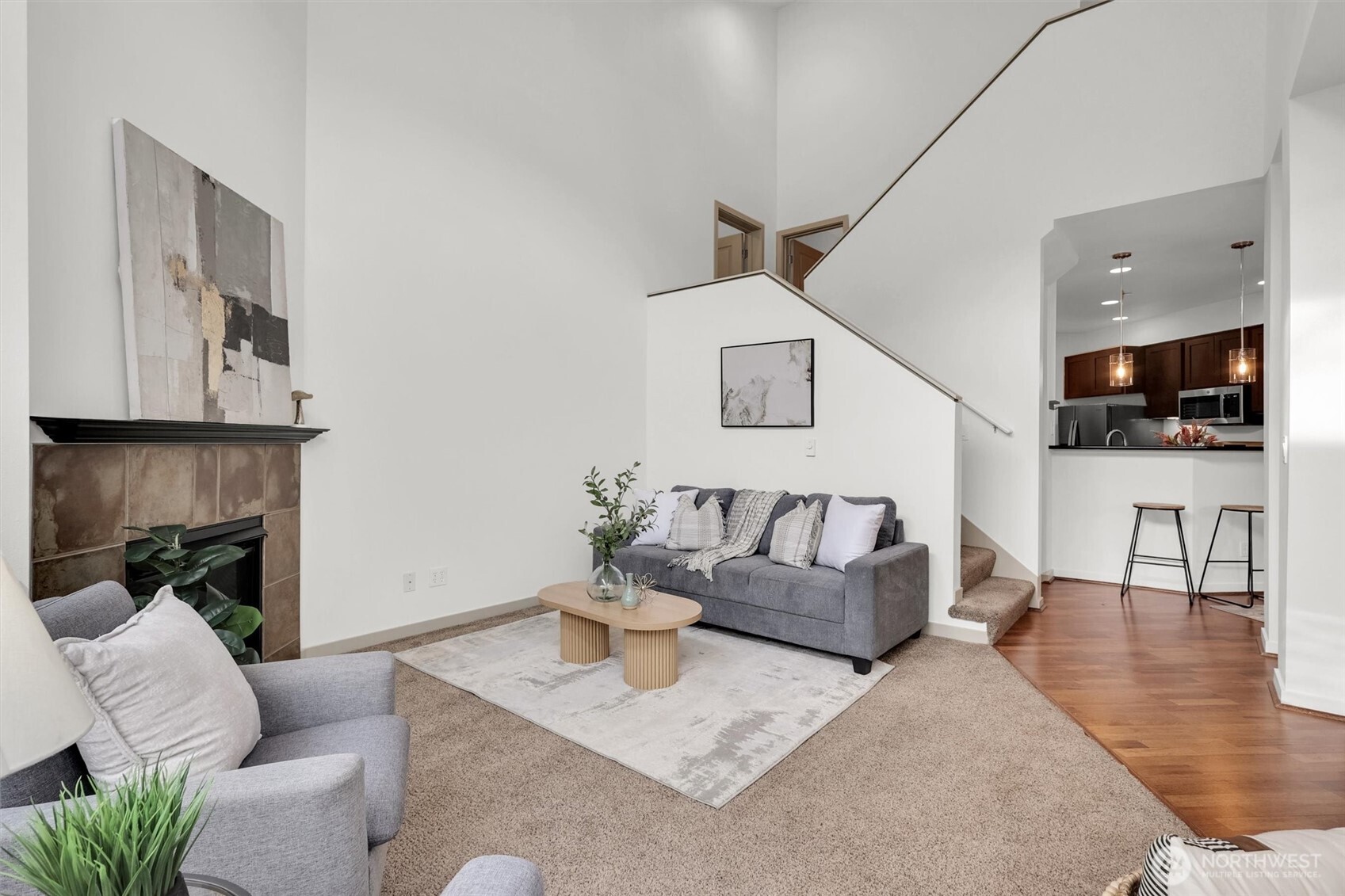 Spacious living area with large windows and room to relax or entertain.