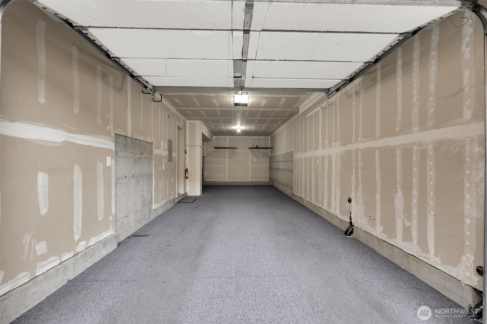 TWO-CAR TANDEM GARAGE with excellent storage potential or home gym!