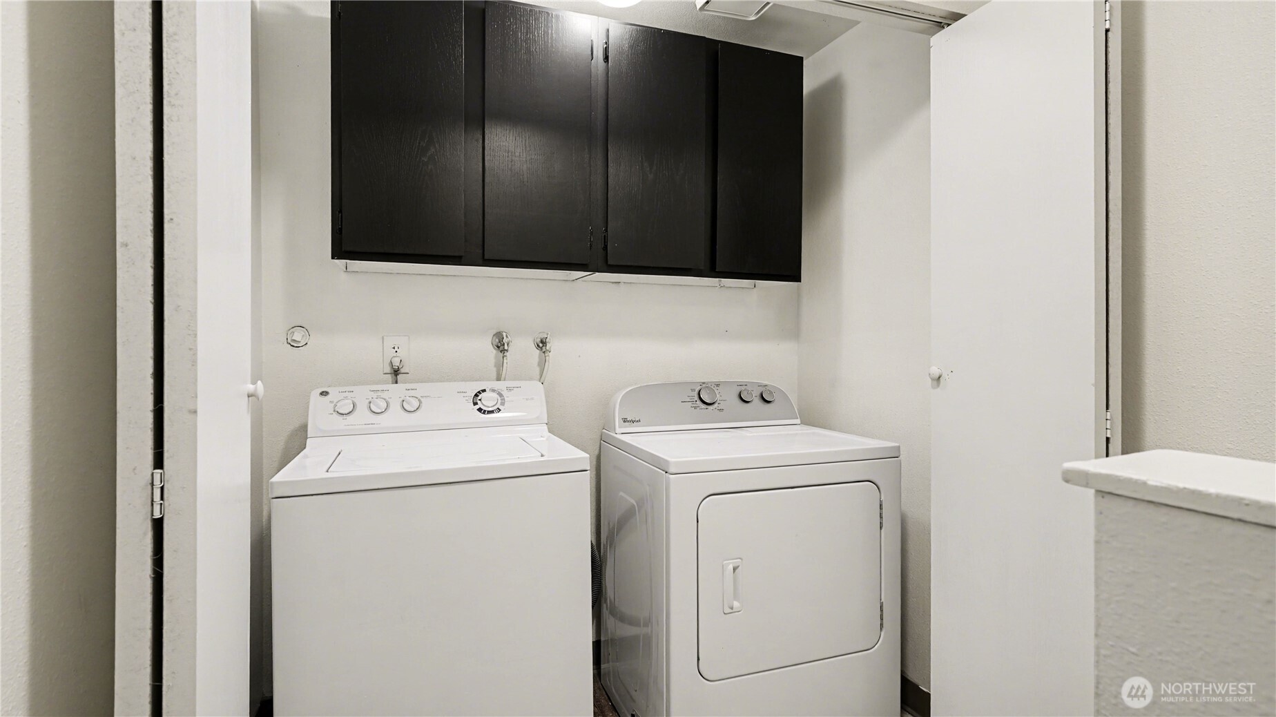 Upstairs laundry with storage for convenance.