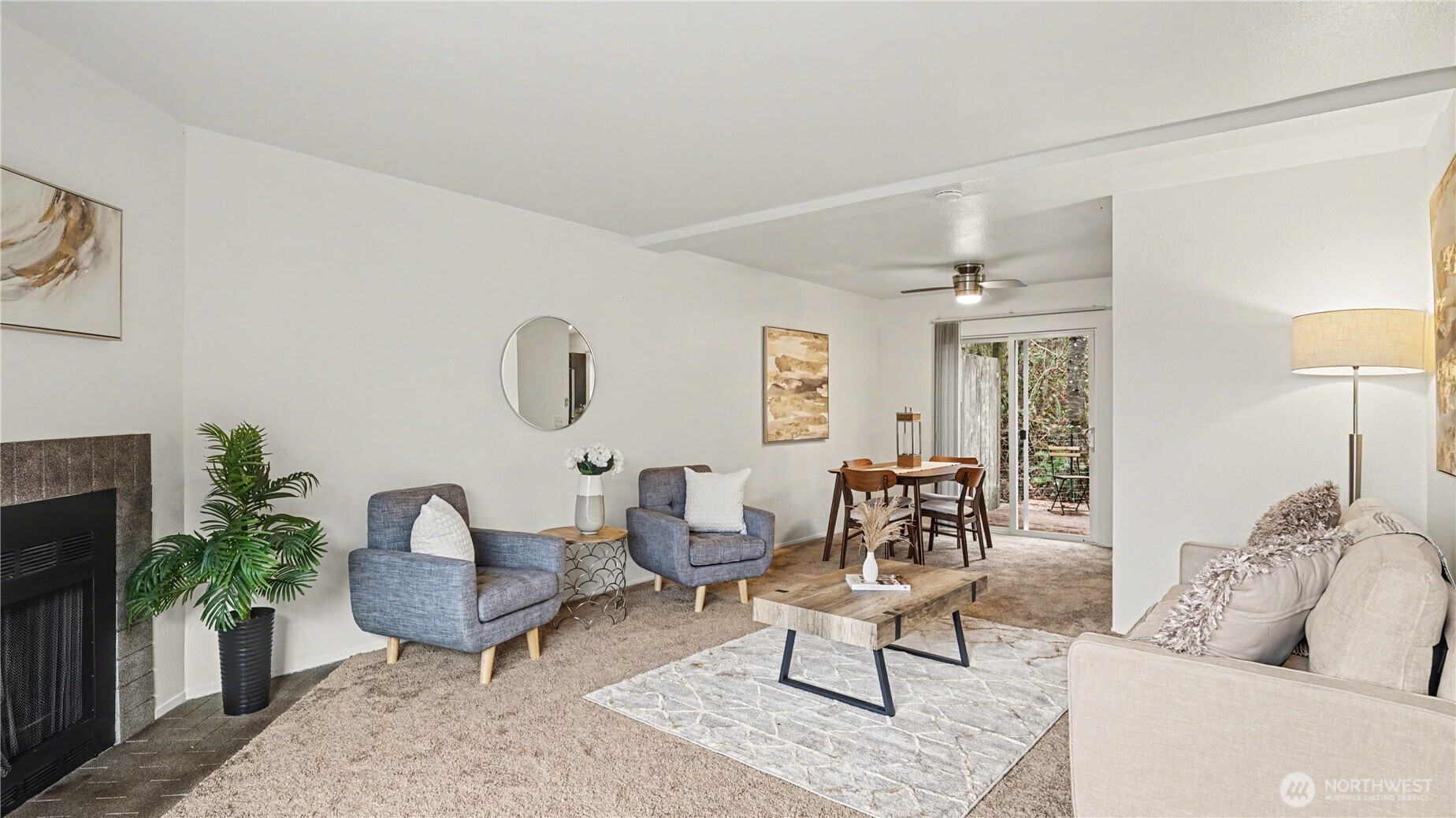 Living and dining area seamlessly flow together with private balcony just off the living room