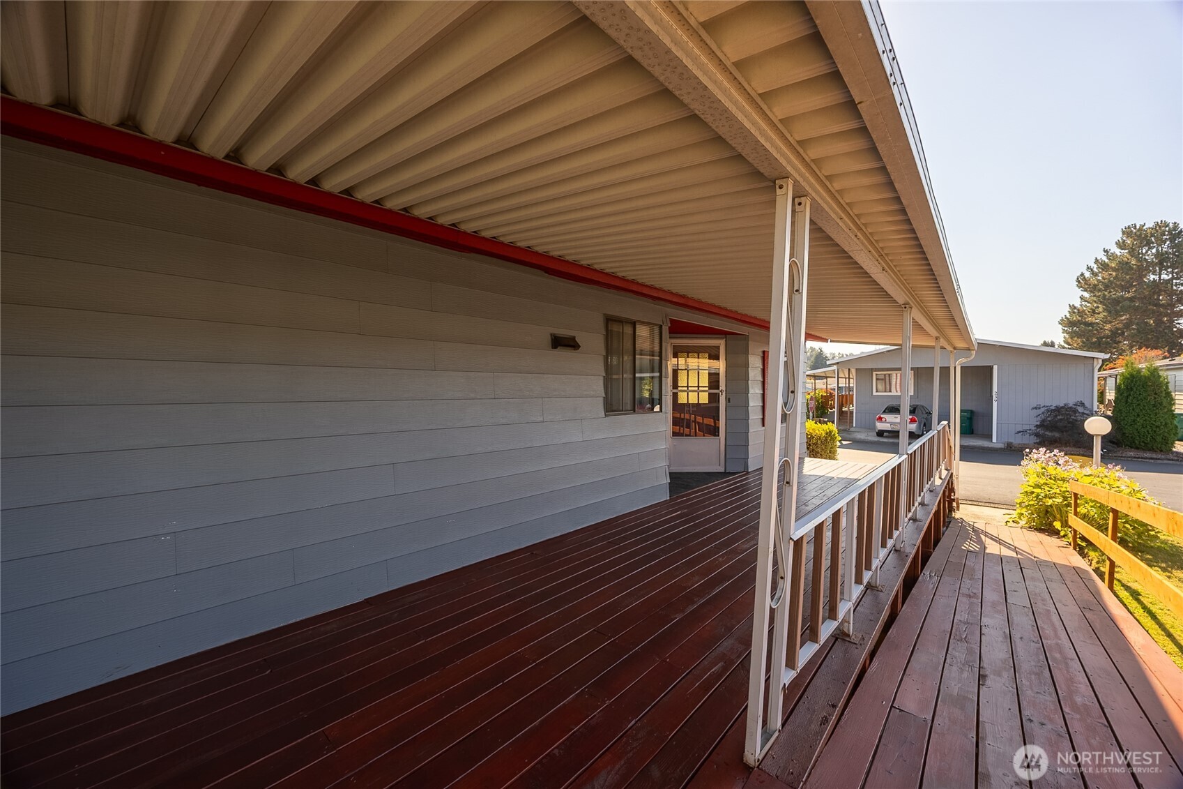 Spacious Covered Porch.  Stairs on both ends Plus a Ramp!