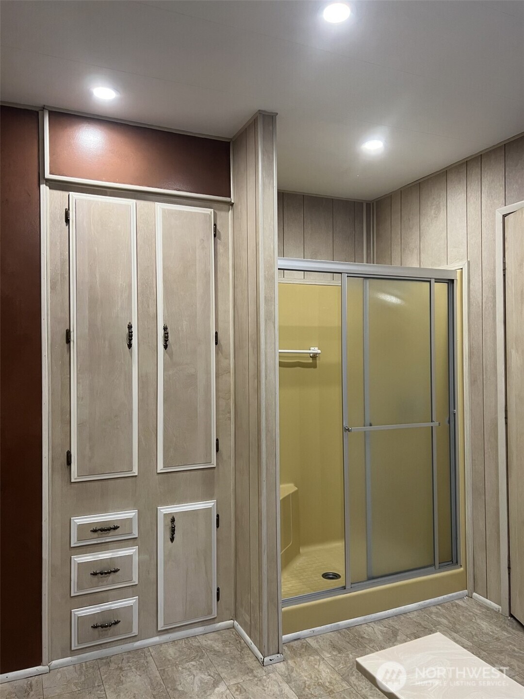 Primary 5 piece bathroom with Walk in Shower with seat, Separate Soaking Bathtub, And plentiful storage!